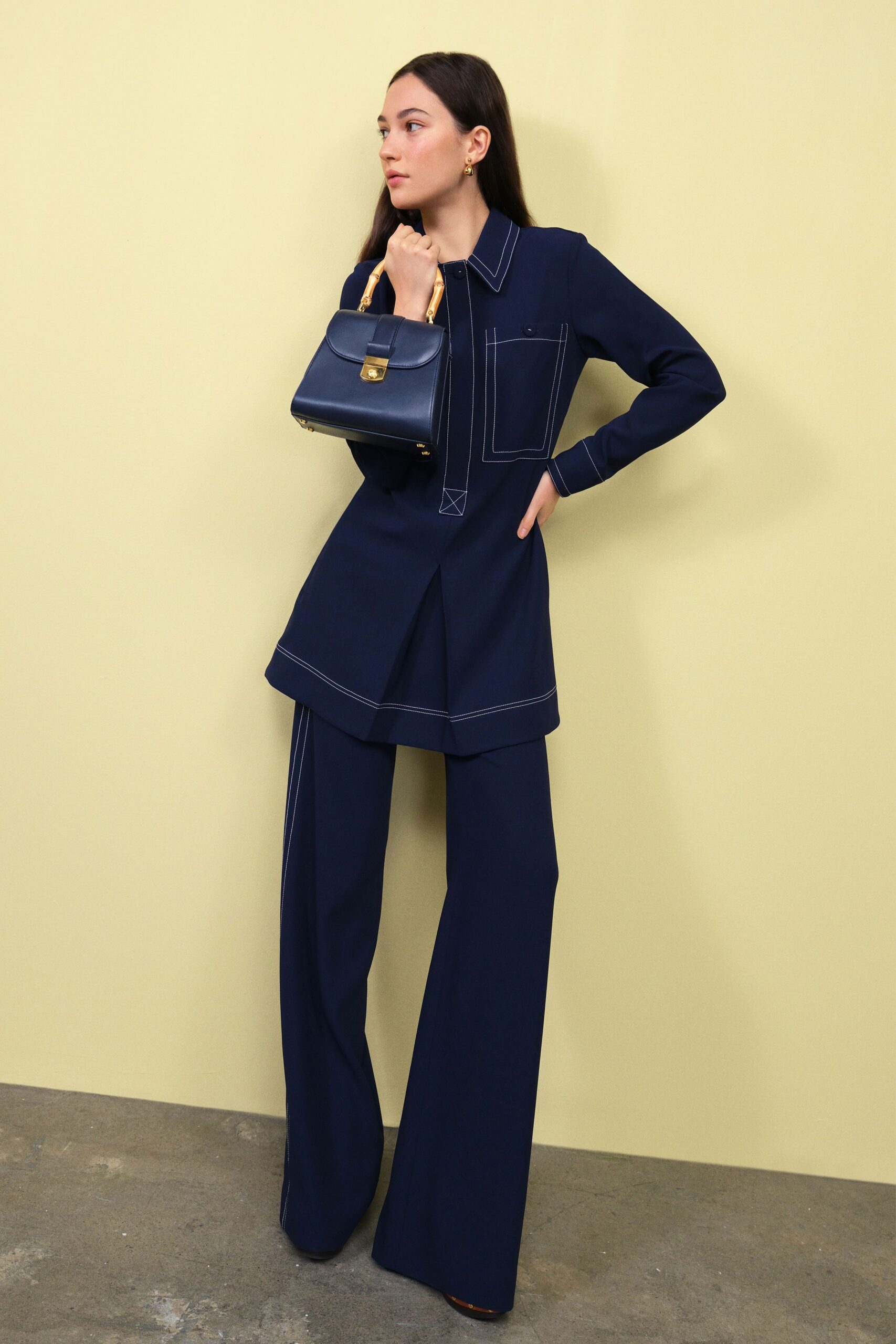 blue long-sleeve collared relaxed buttoned pockets top