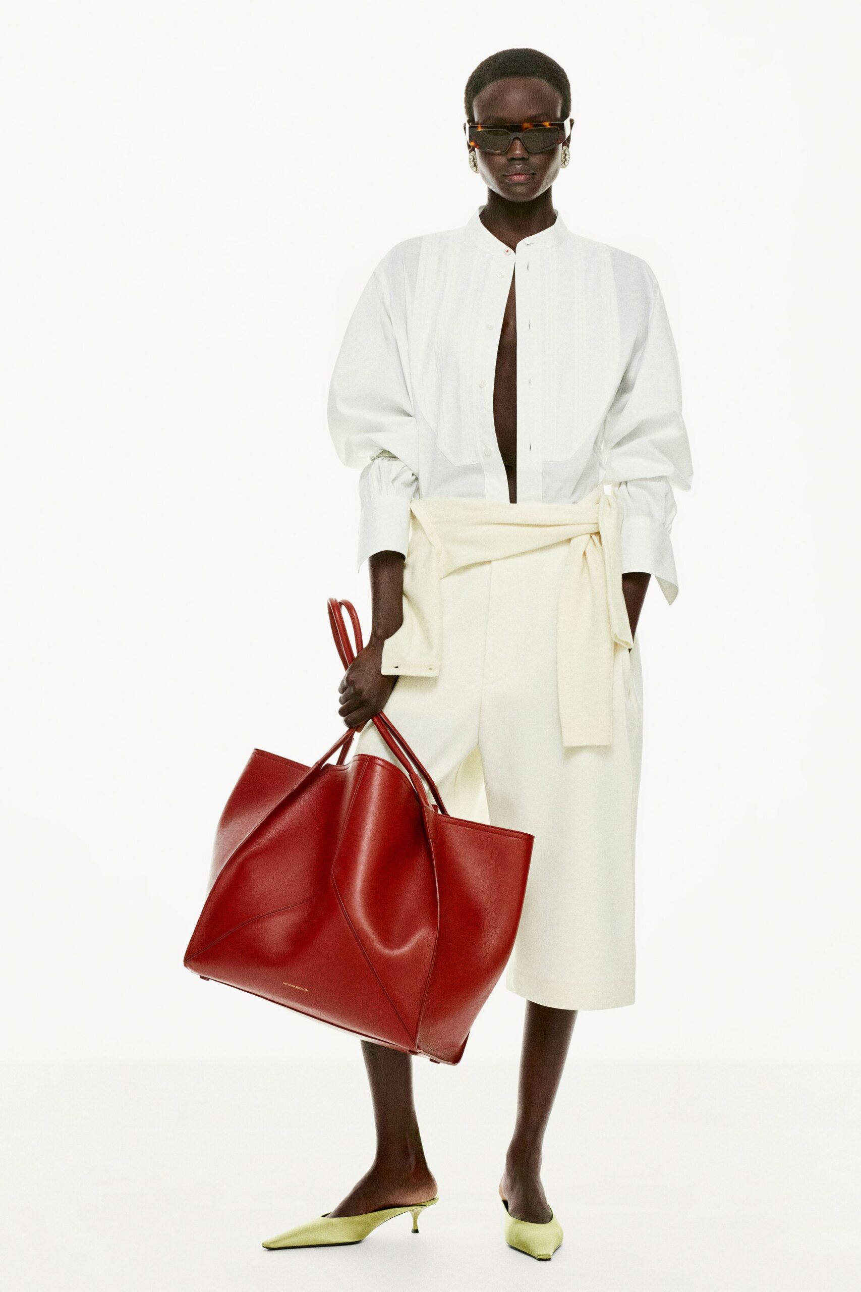 white fitted shirt with beige shorts