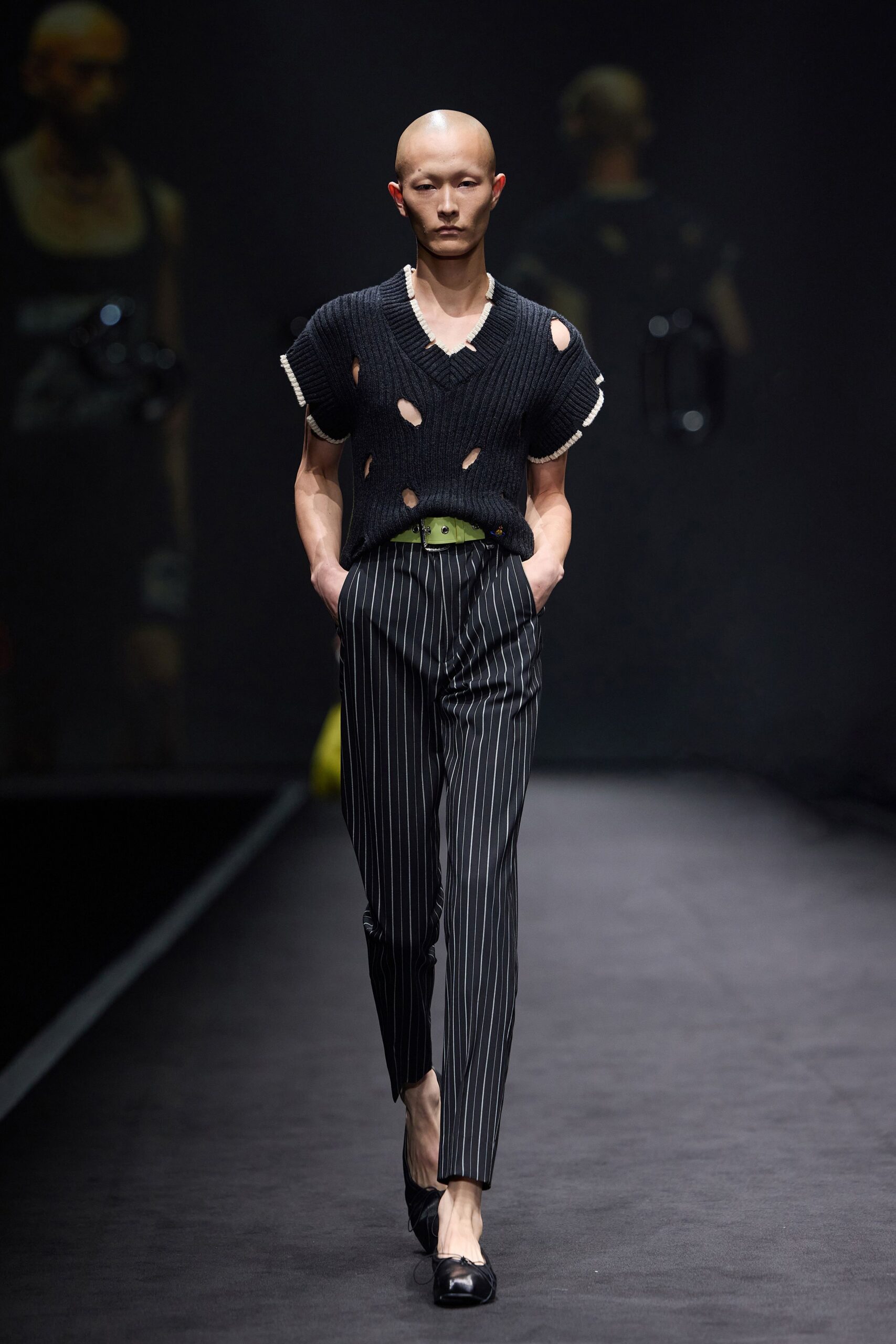 black distressed top with striped pants