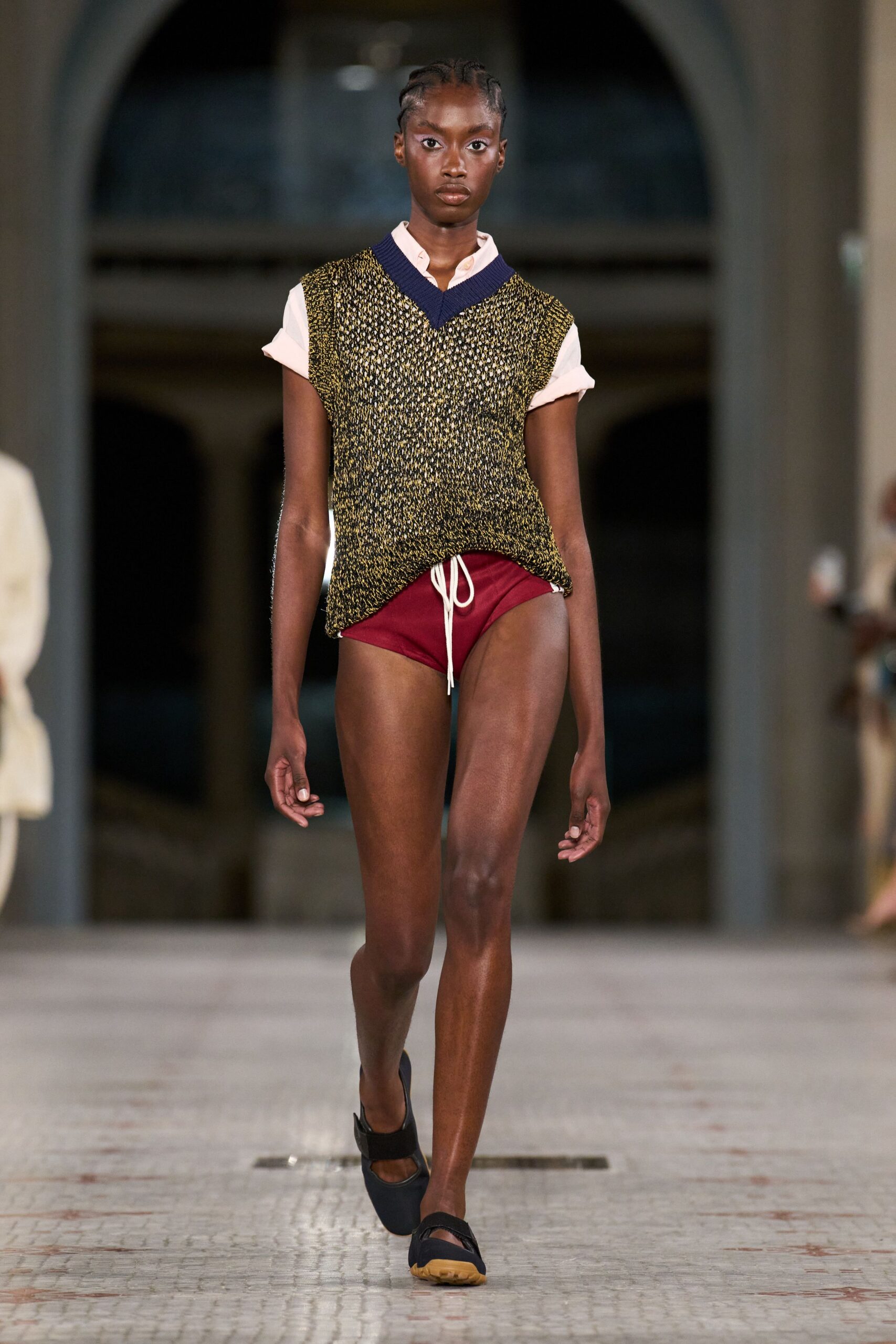 black and yellow relaxed top with red shorts