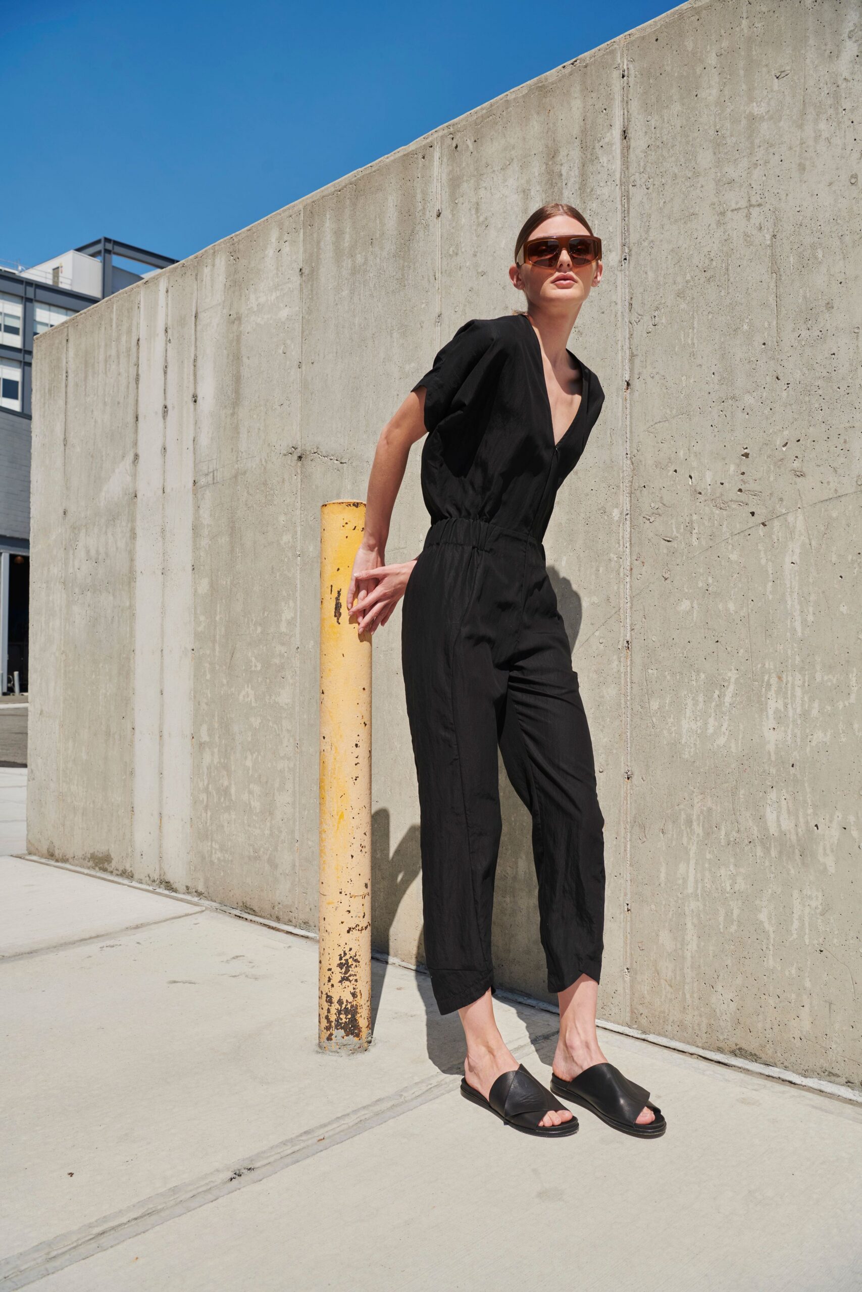 black relaxed jumpsuit with sandals