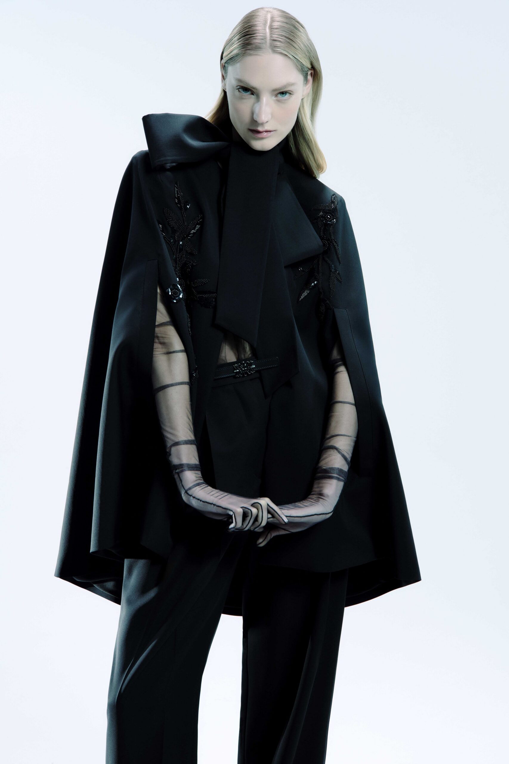 black silk cape and tailored pants