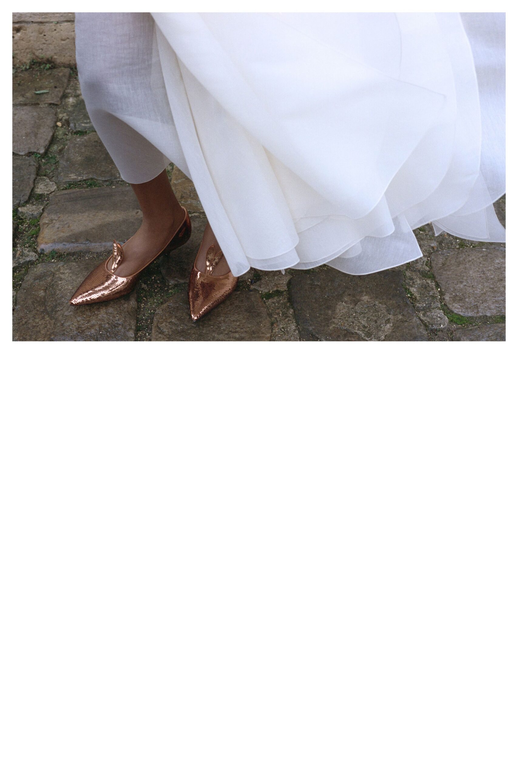 white layered midi dress with gold shoes