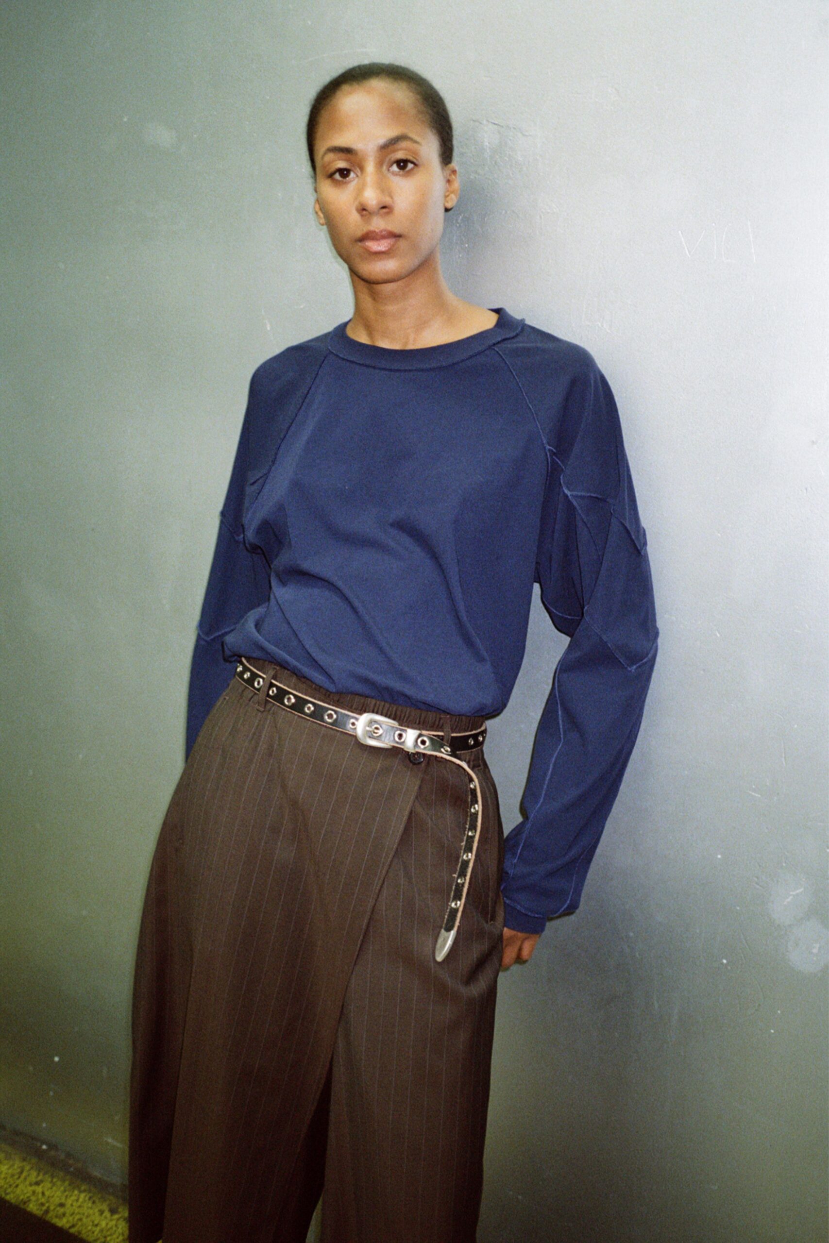 blue relaxed top with brown pants