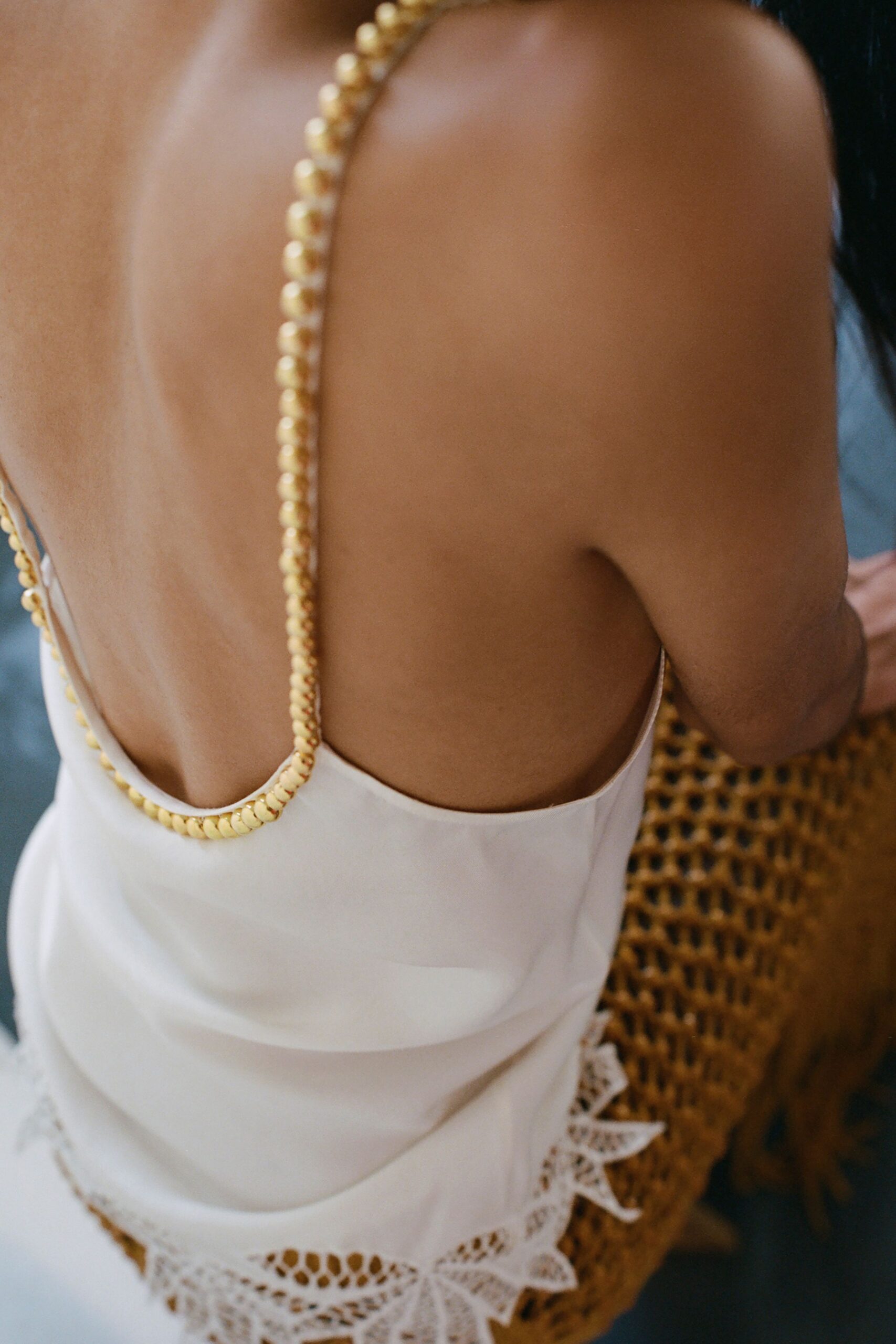 fitted white silk backless top