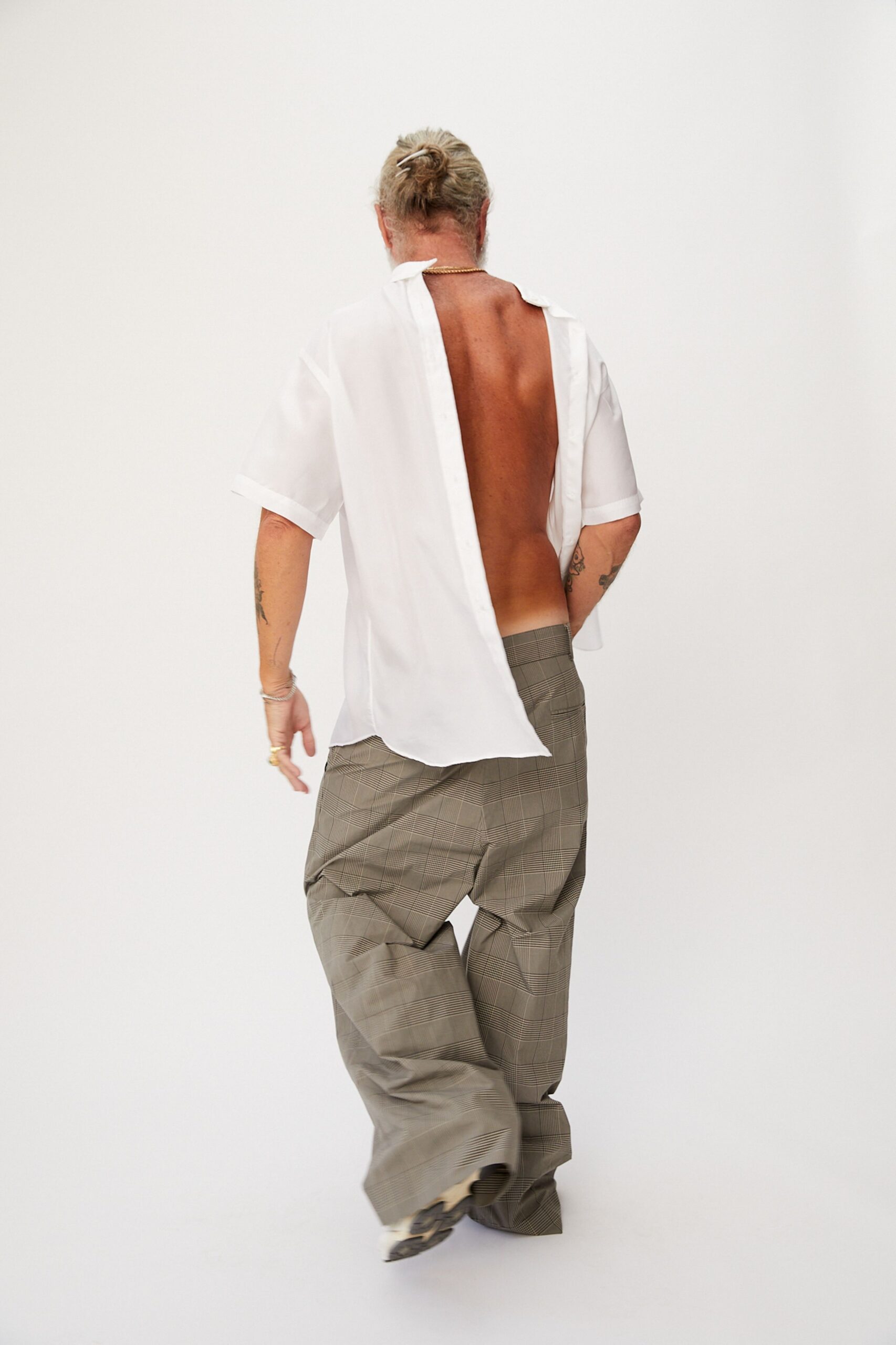 white relaxed shirt and gray pants