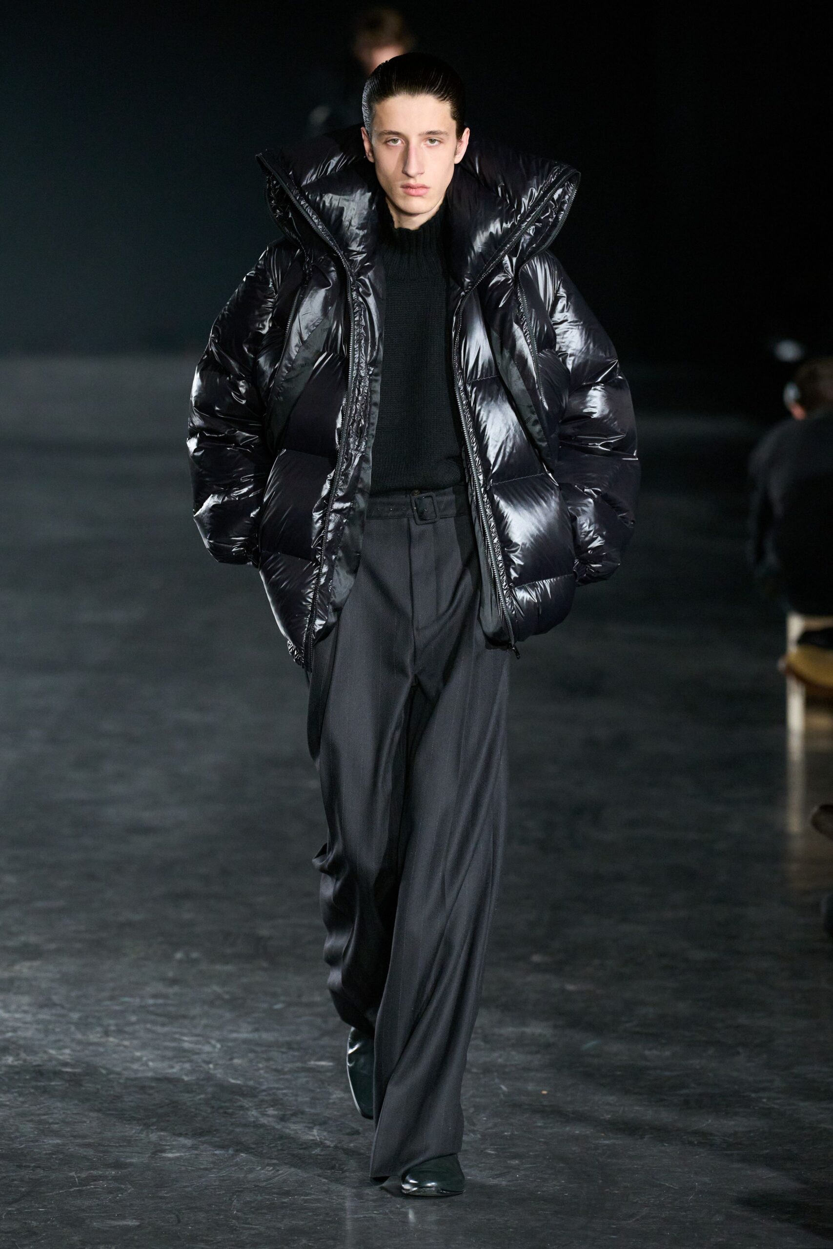 black vinyl jacket with sweater and pants