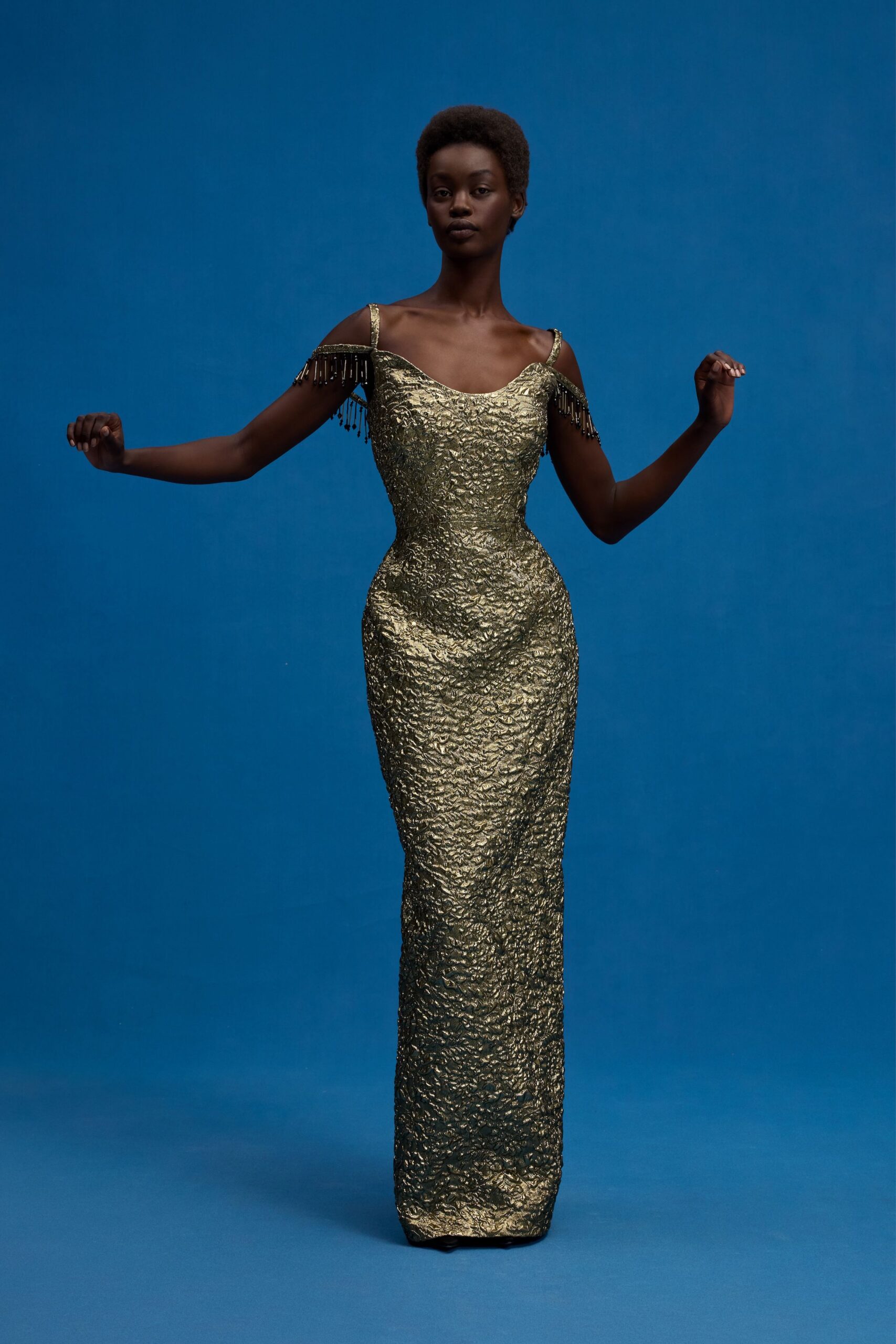 gold textured off-shoulder gown