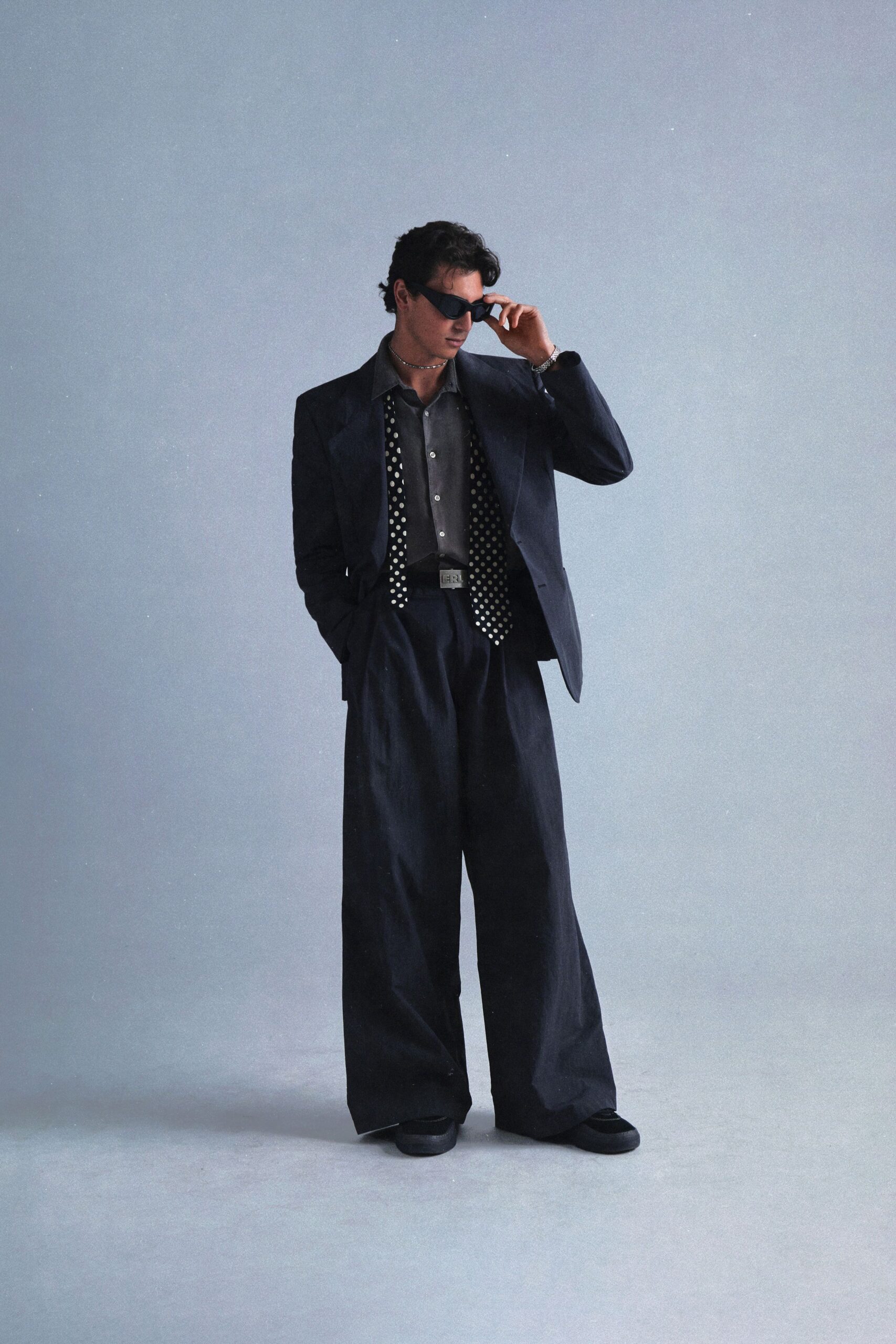 black cotton long-sleeve collared relaxed buttoned suit