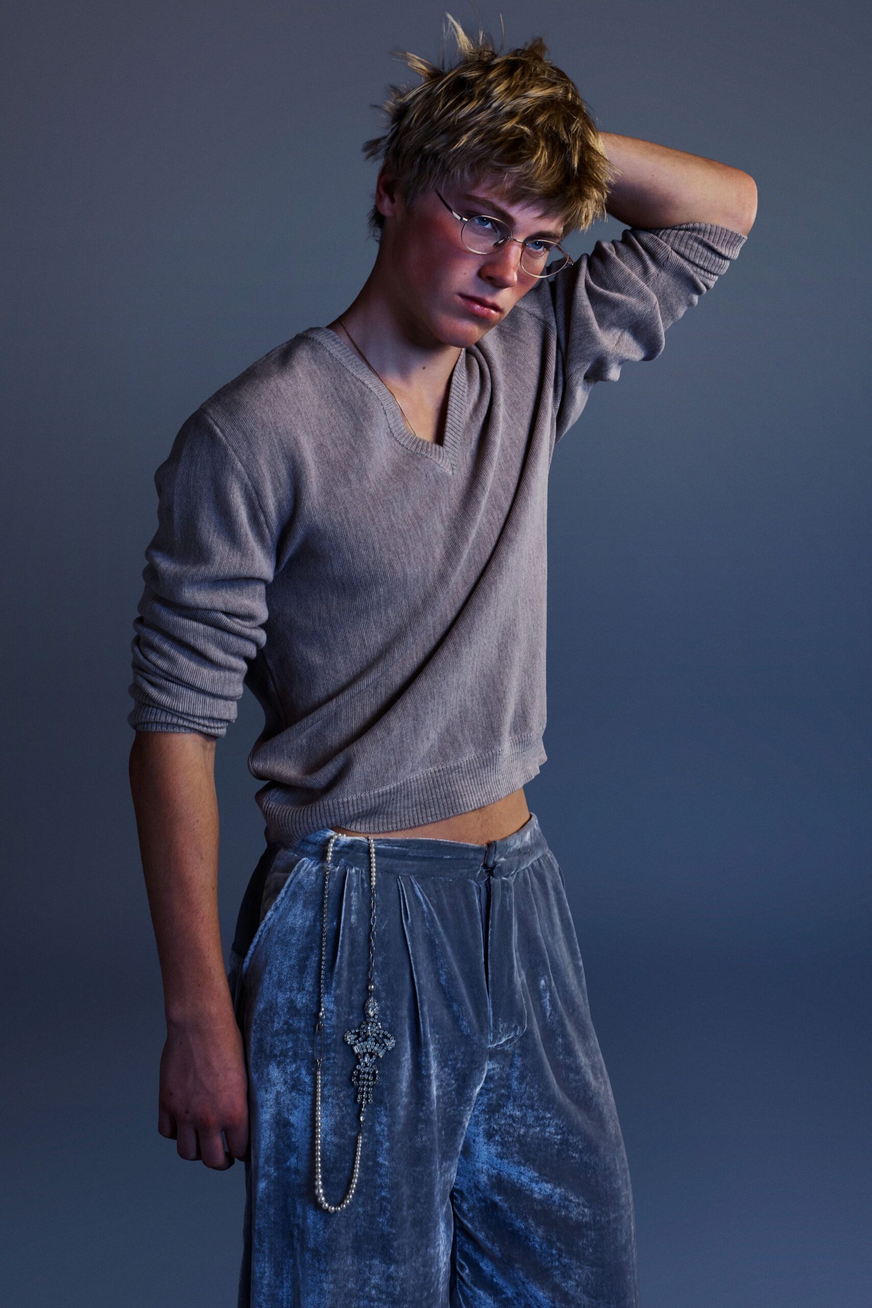 beige fitted sweater and gray relaxed pants