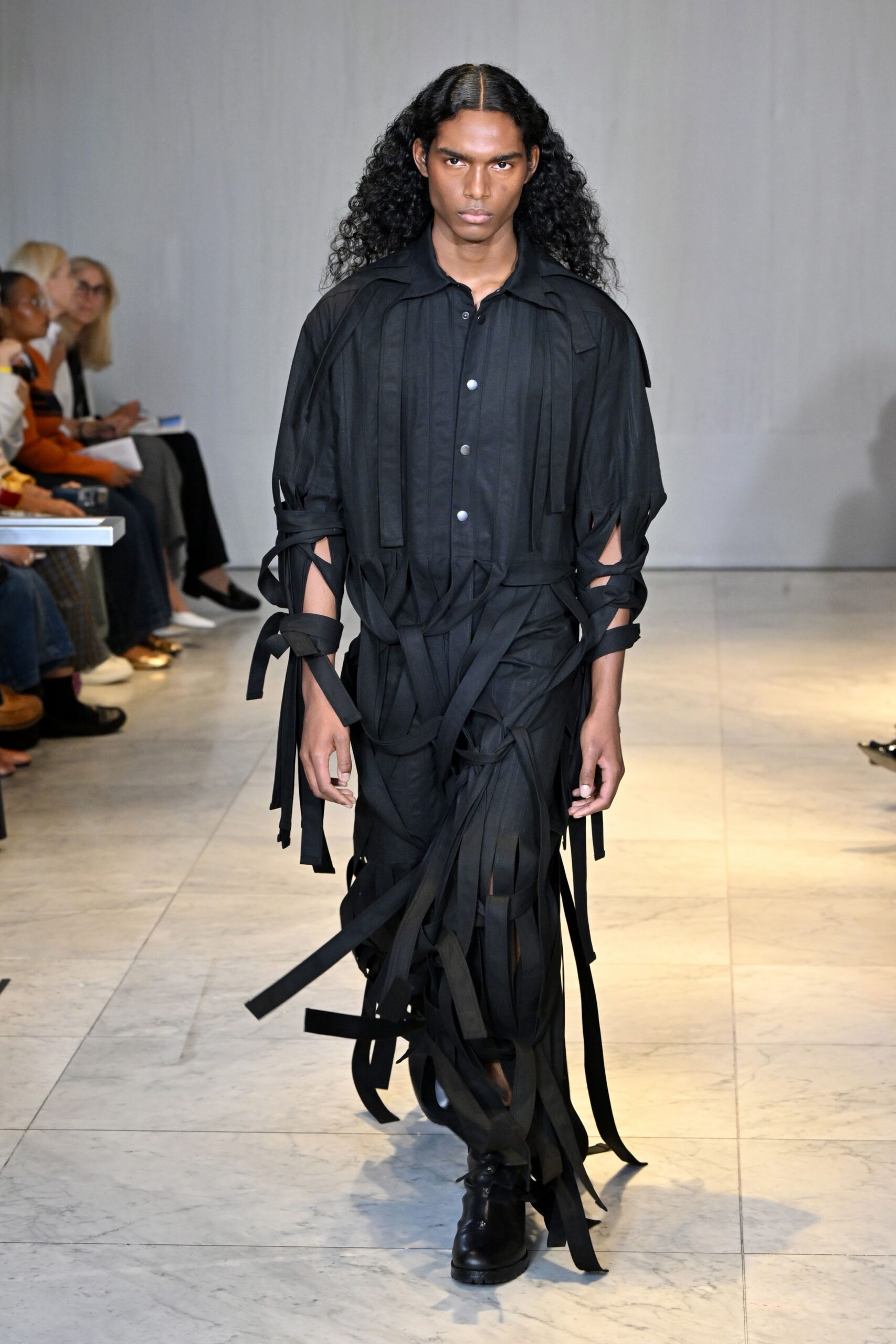 black fringed jumpsuit with shoes