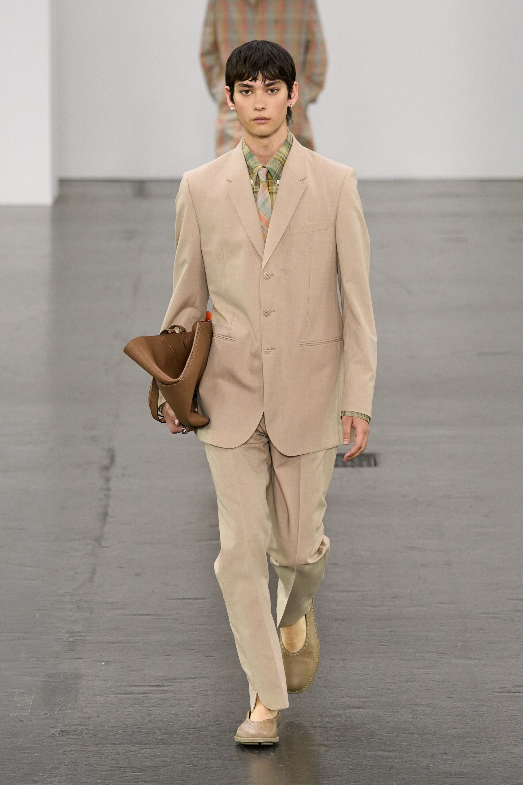beige tailored suit with brown accessories