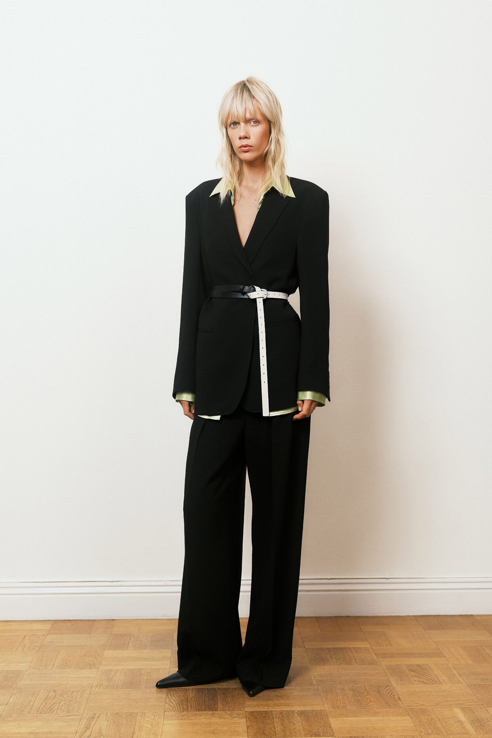 black tailored blazer with green shirt