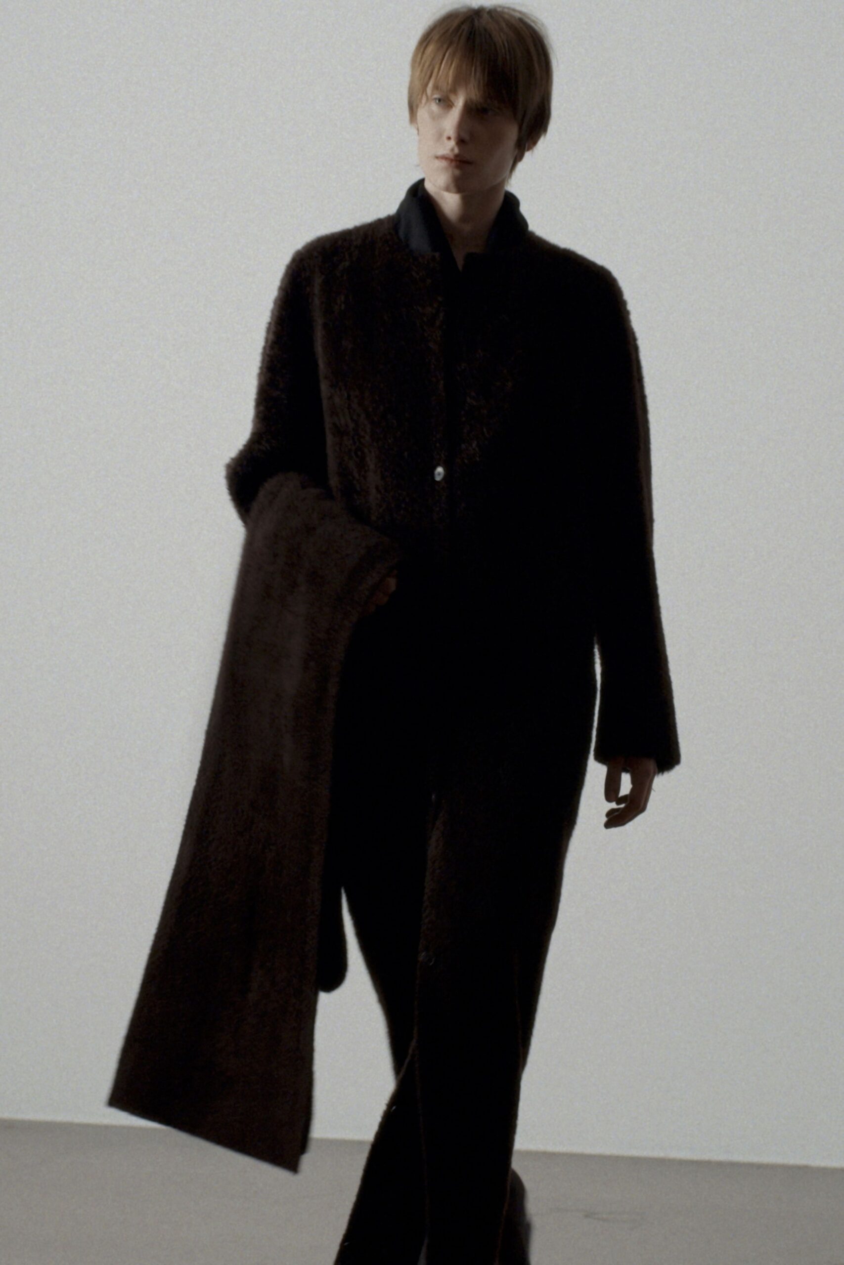 black wool long-sleeve collared relaxed buttoned coat