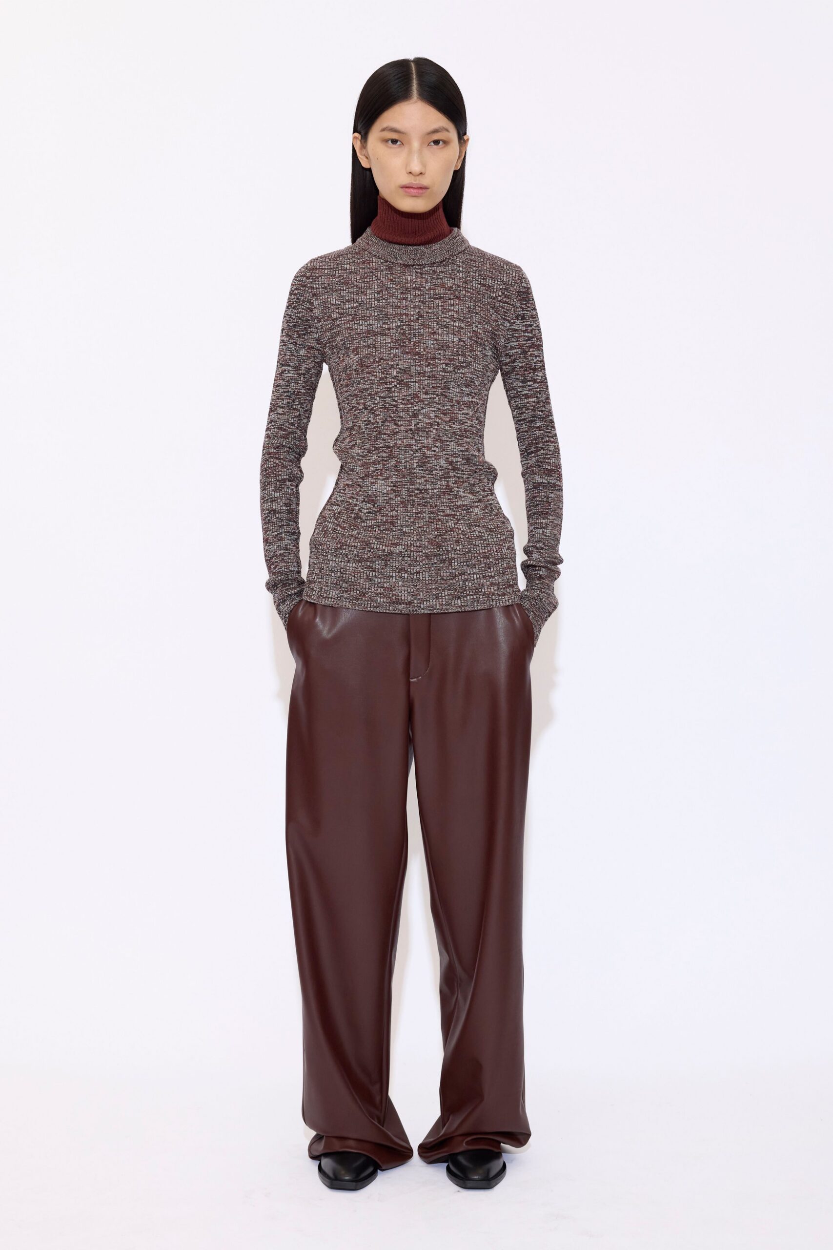 gray wool turtleneck top with brown leather pants