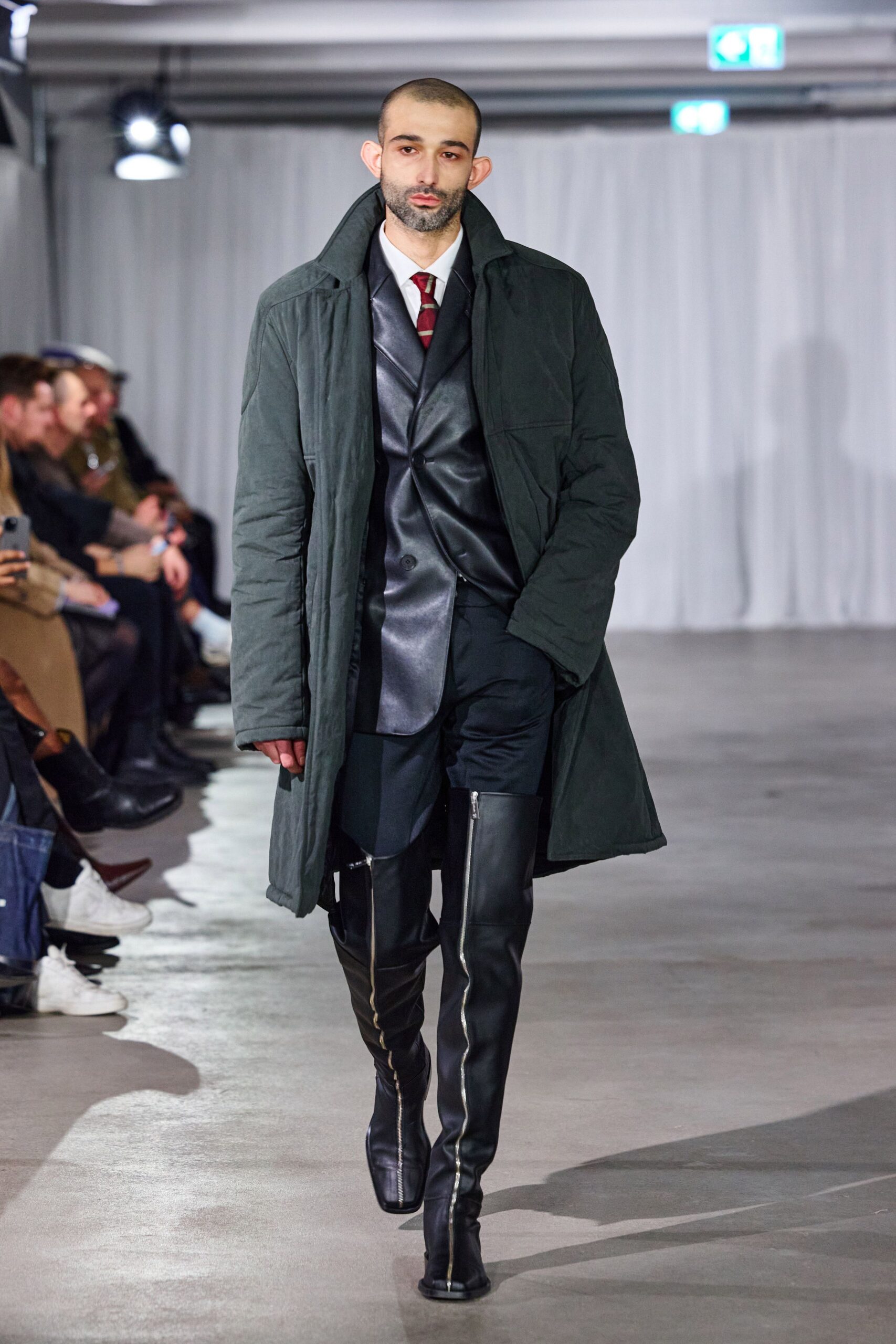 green coat black blazer and pants
