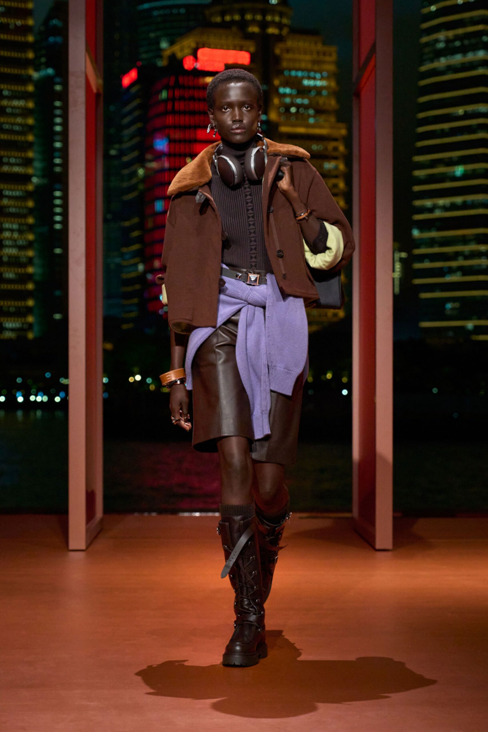 brown jacket black top leather skirt