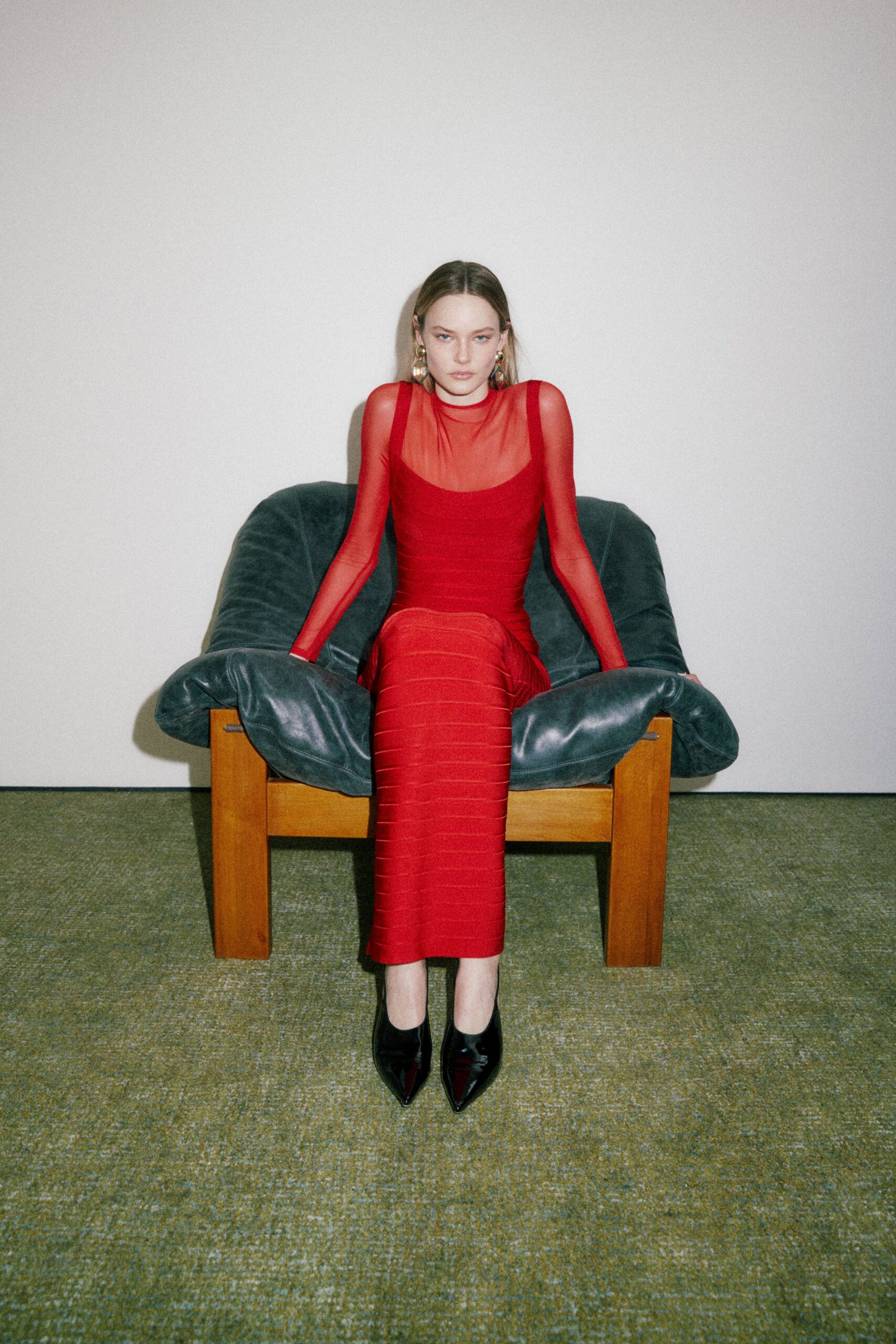 red fitted midi dress with sheer sleeves