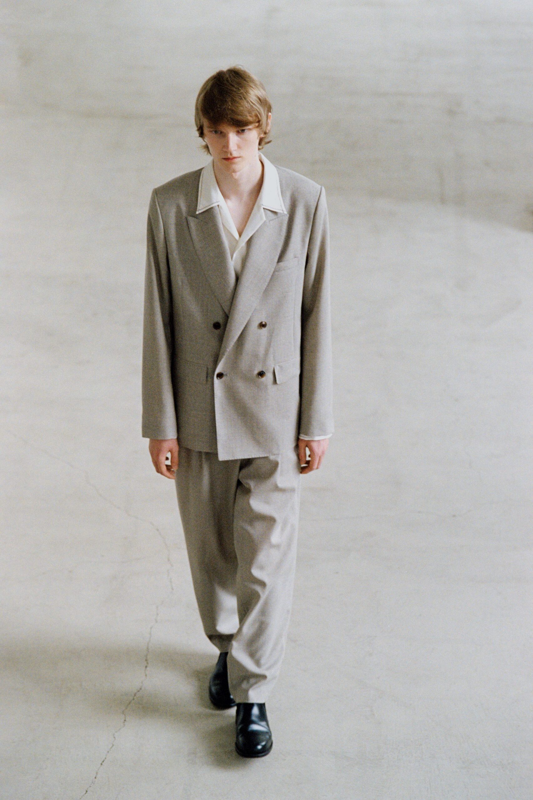 gray tailored suit with black shoes