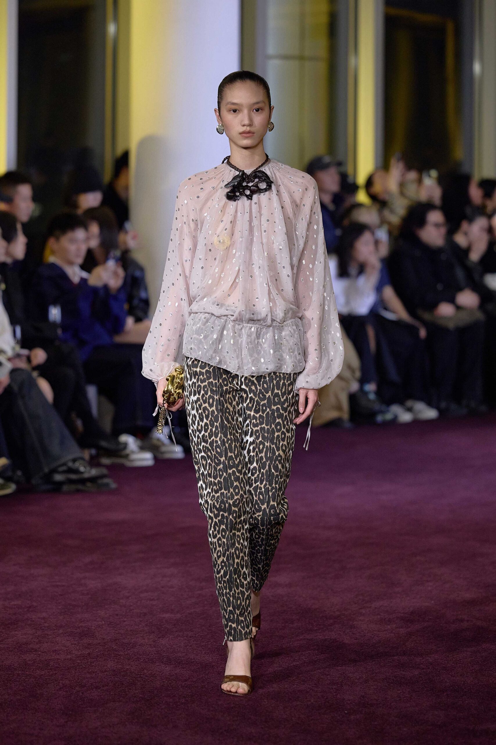 pink sheer blouse with animal-print pants