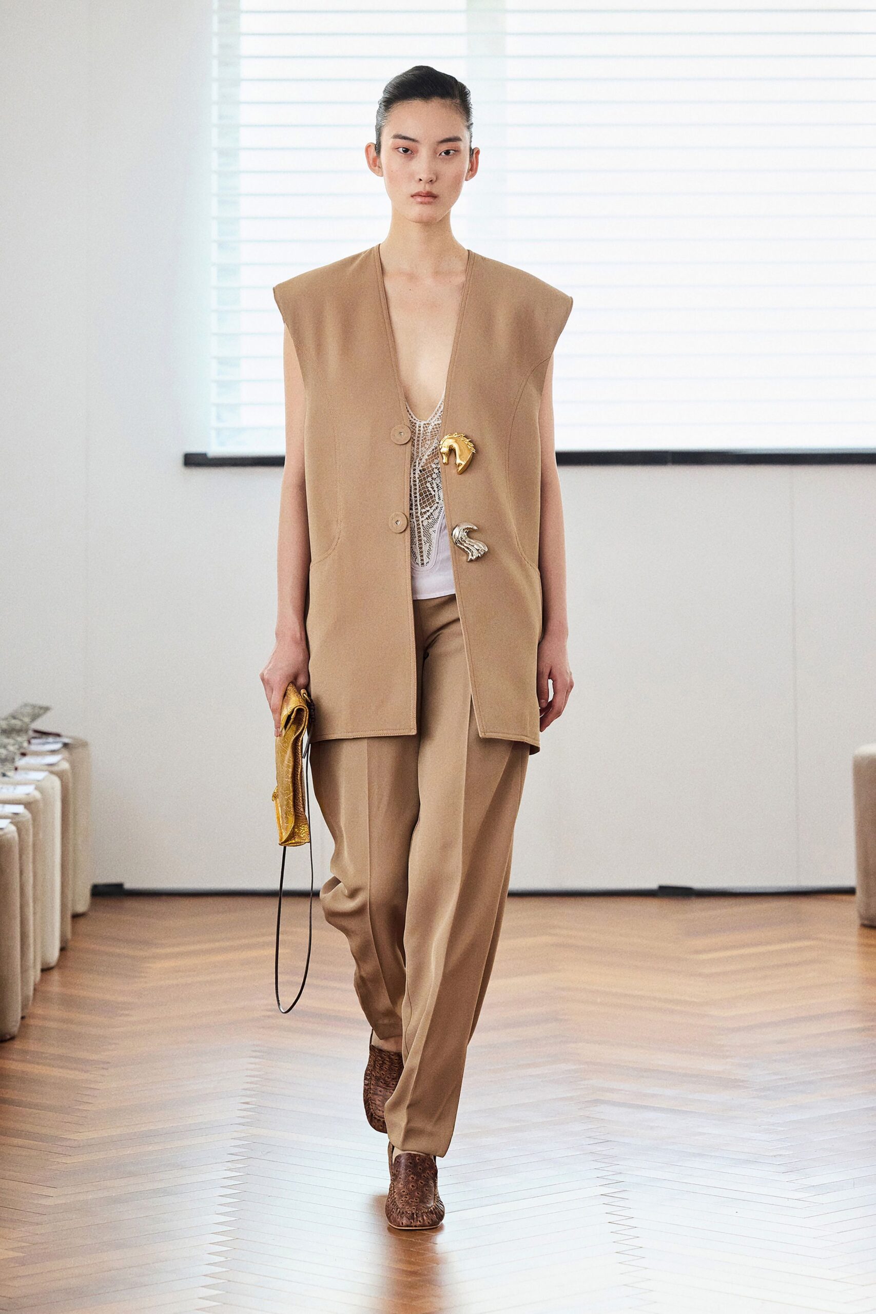 beige vest white top tailored pants