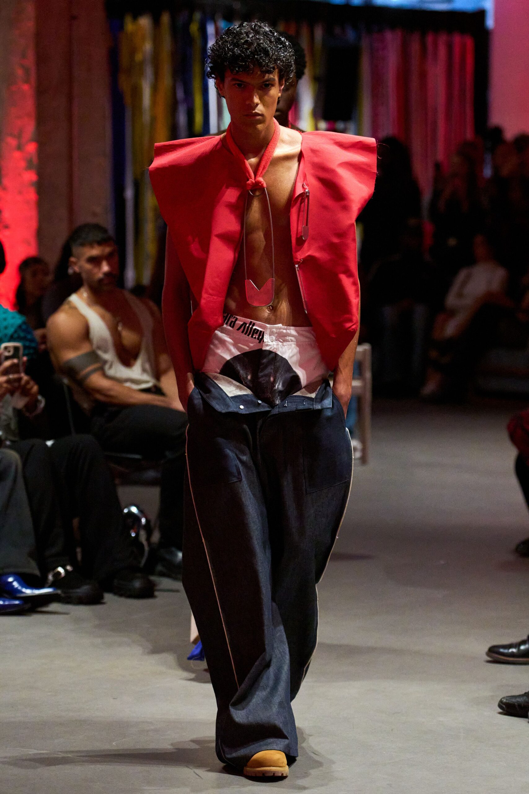 red relaxed top with blue pants