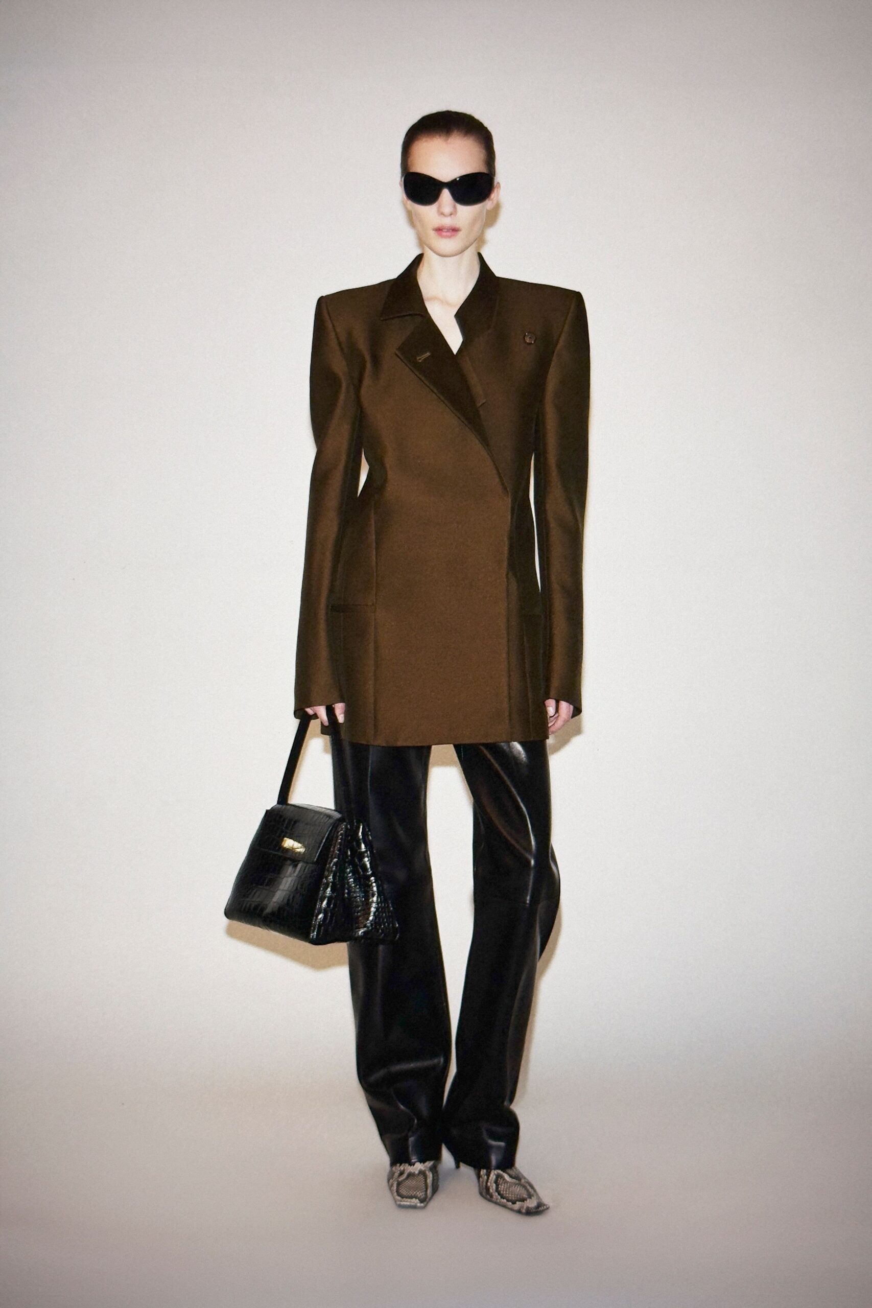 brown tailored blazer with black pants