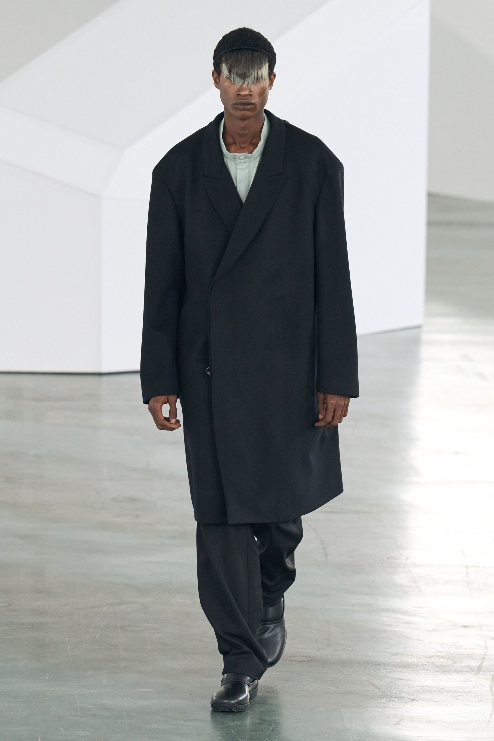oversized black coat with relaxed shirt