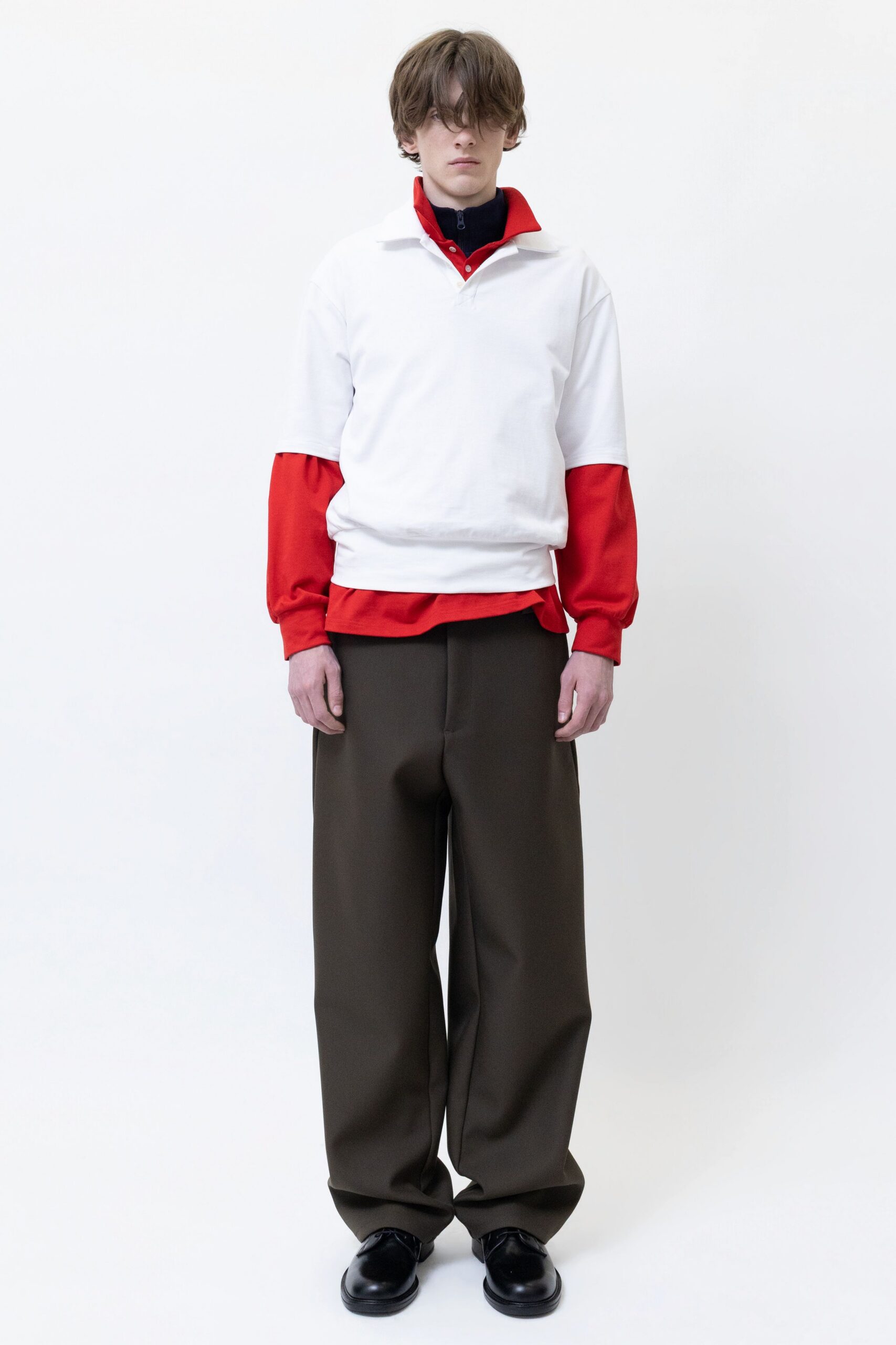 white and red relaxed top with brown pants