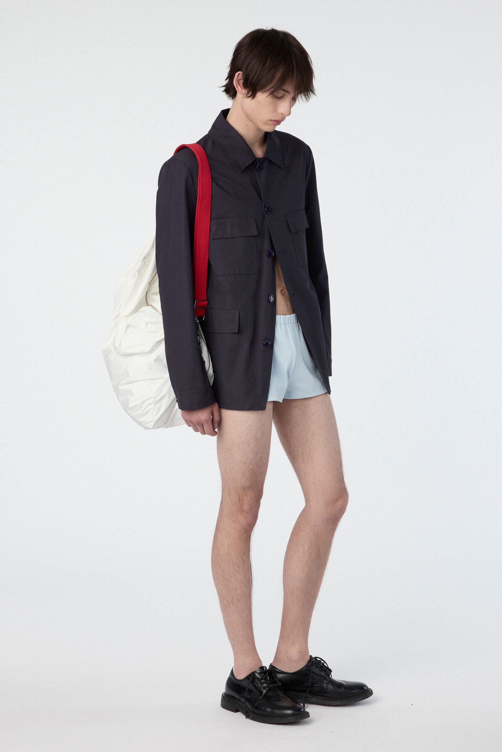 black shirt blue shorts