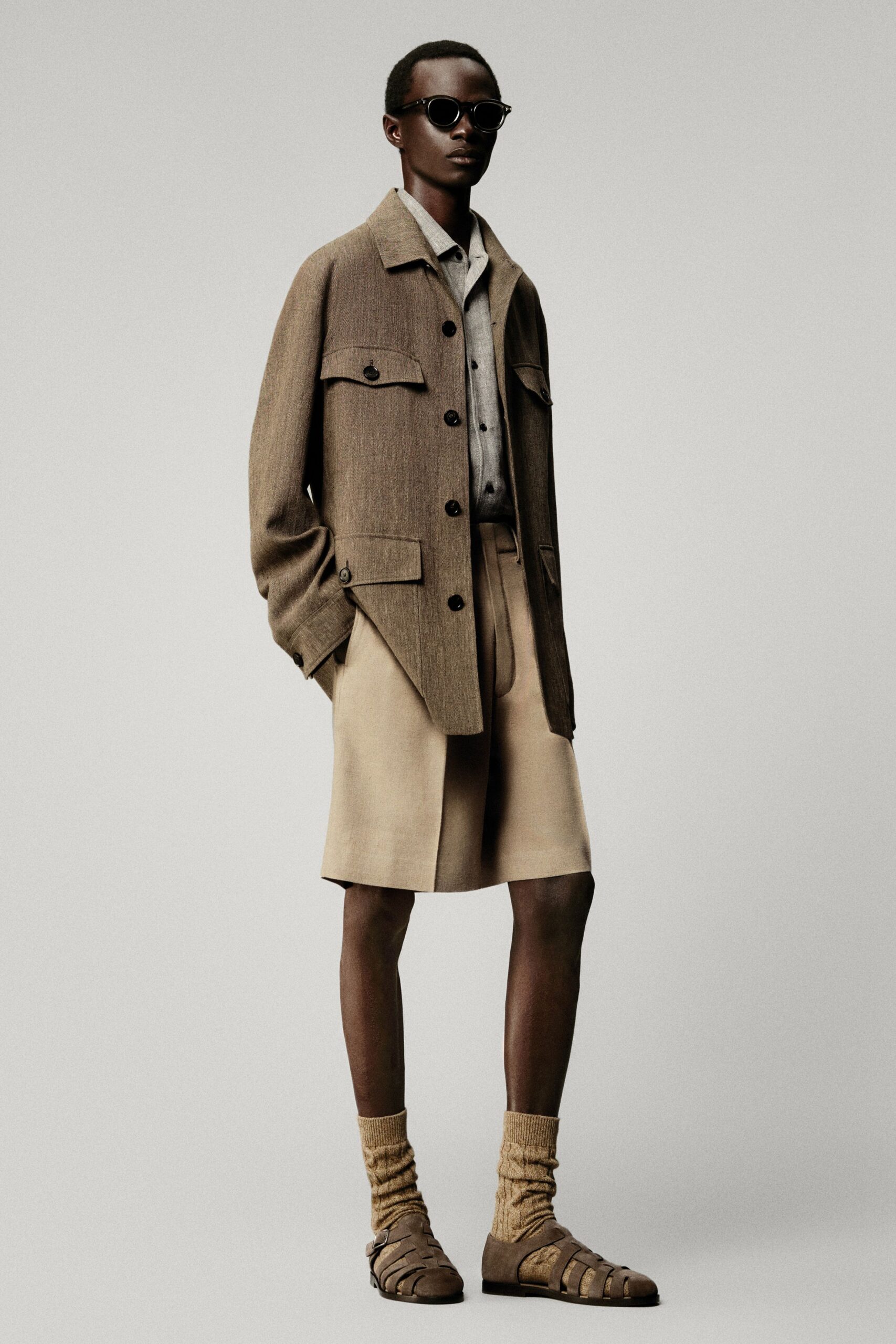 brown relaxed jacket with beige shorts