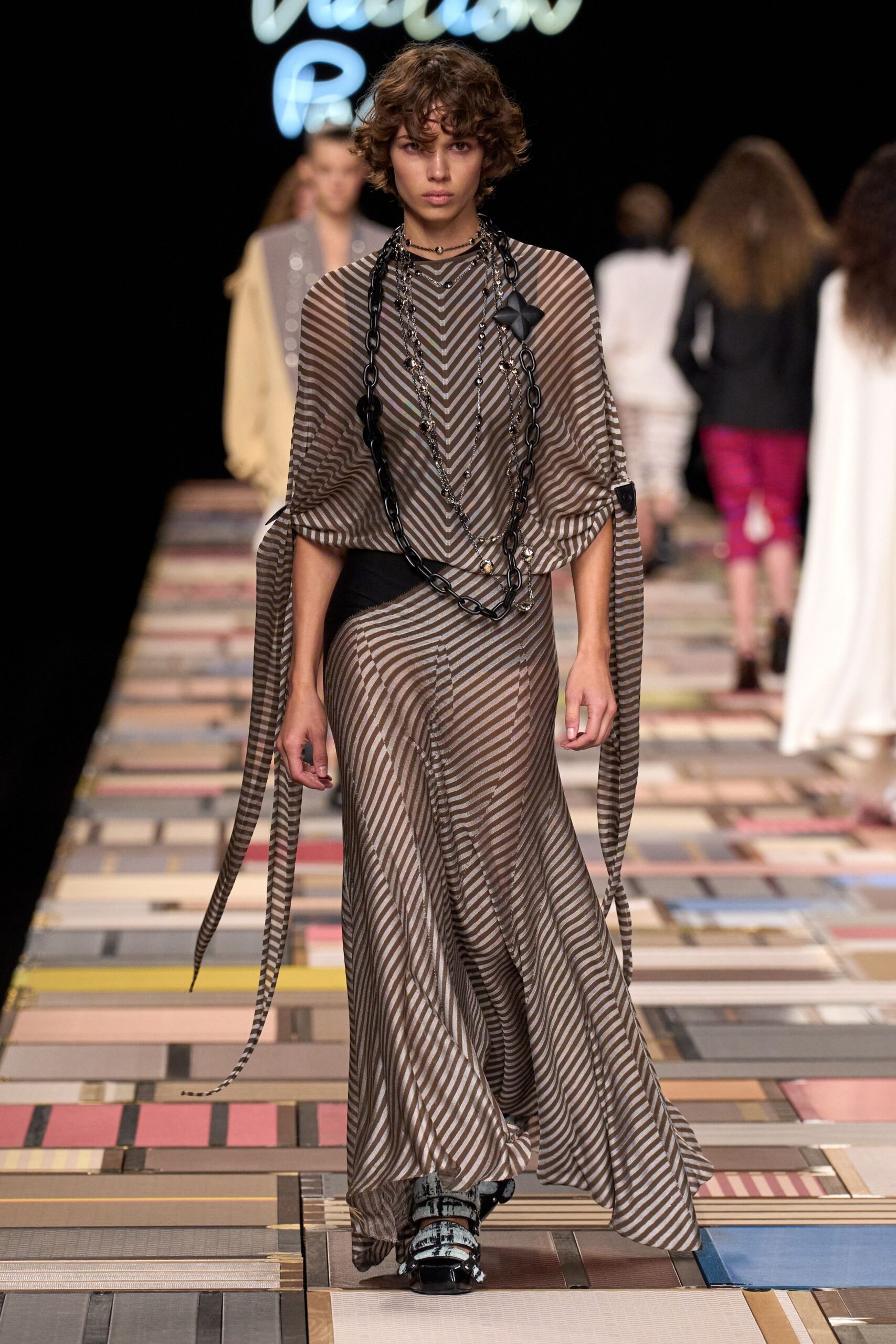 brown silk sleeveless v-neck fitted striped draped gown