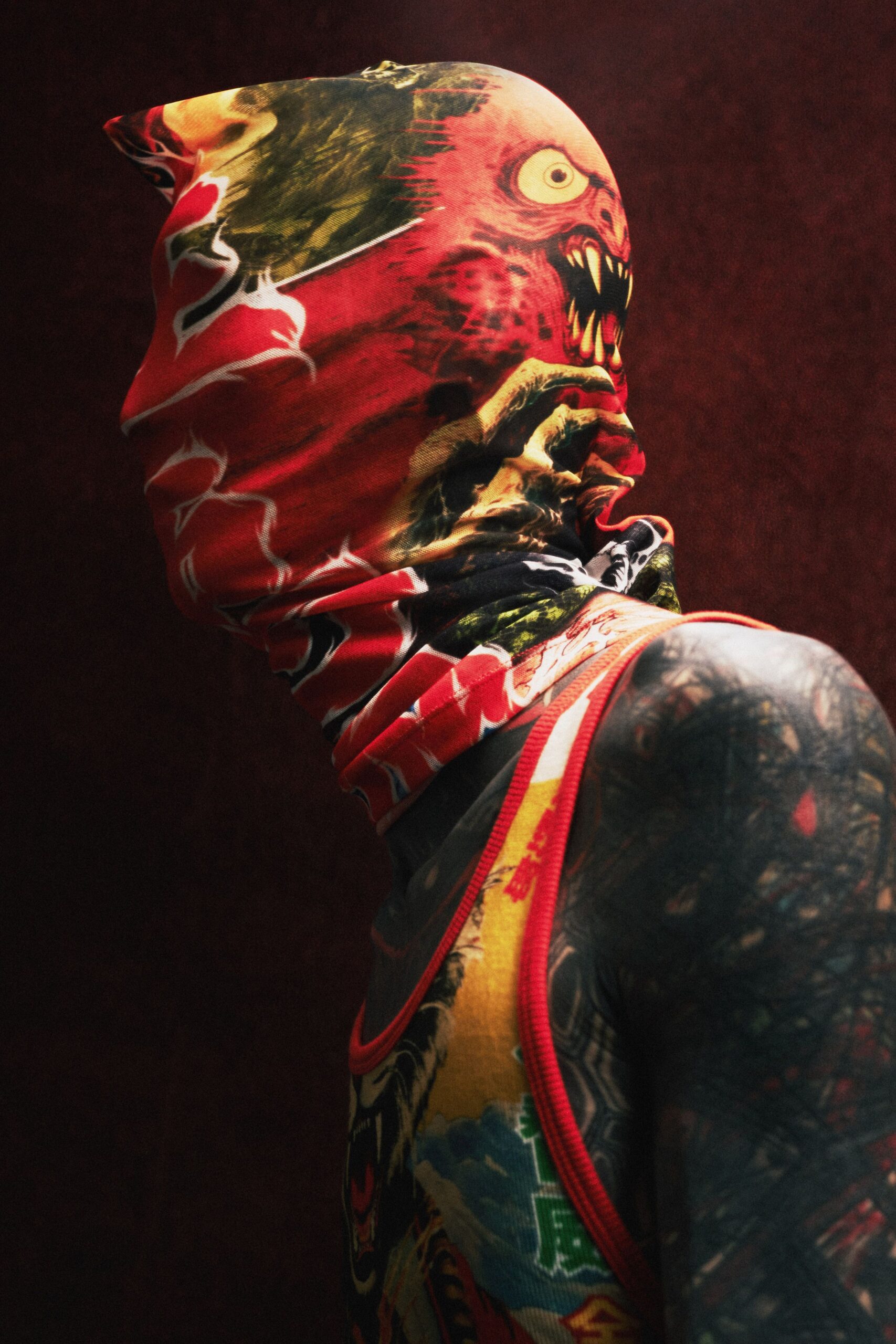 red printed tank-top with face covering