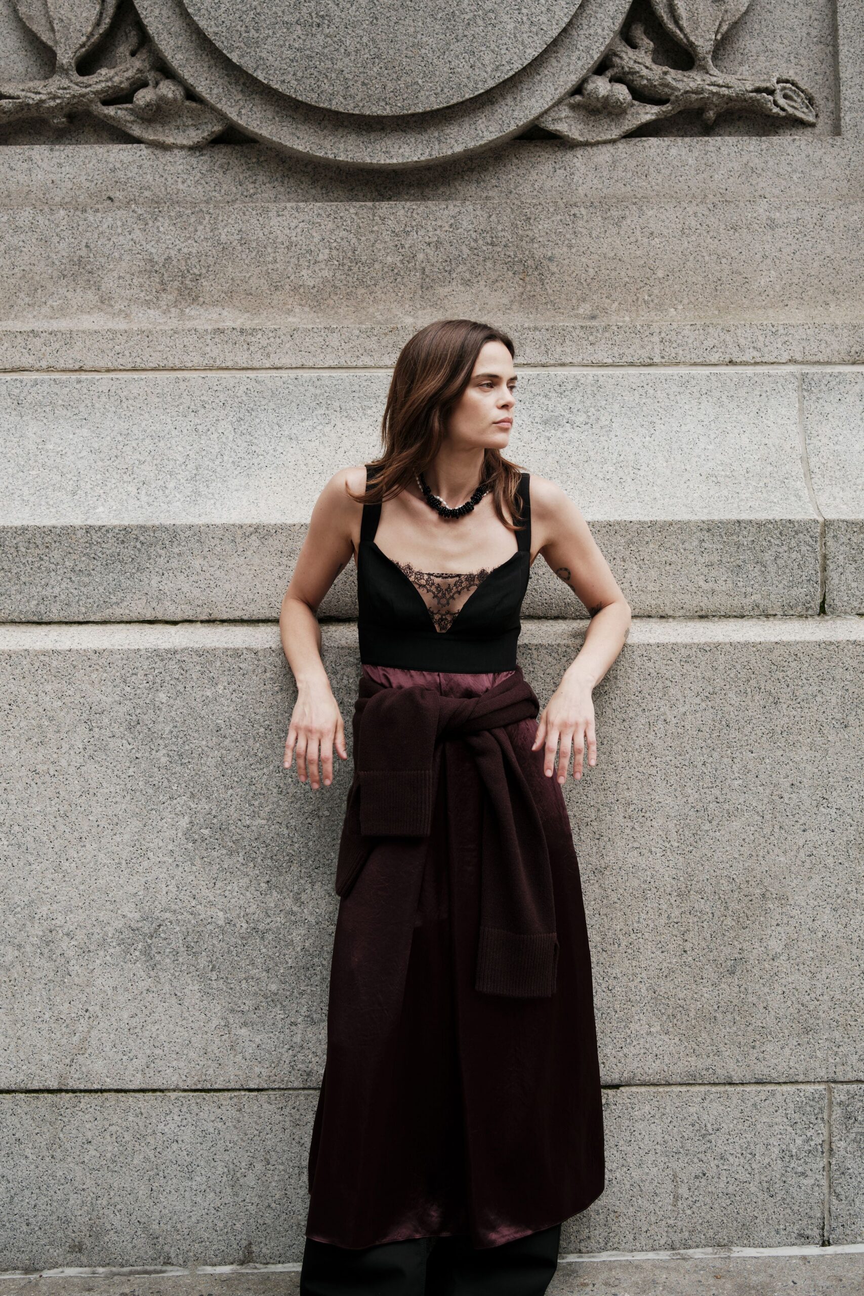 black silk sleeveless top and burgundy skirt