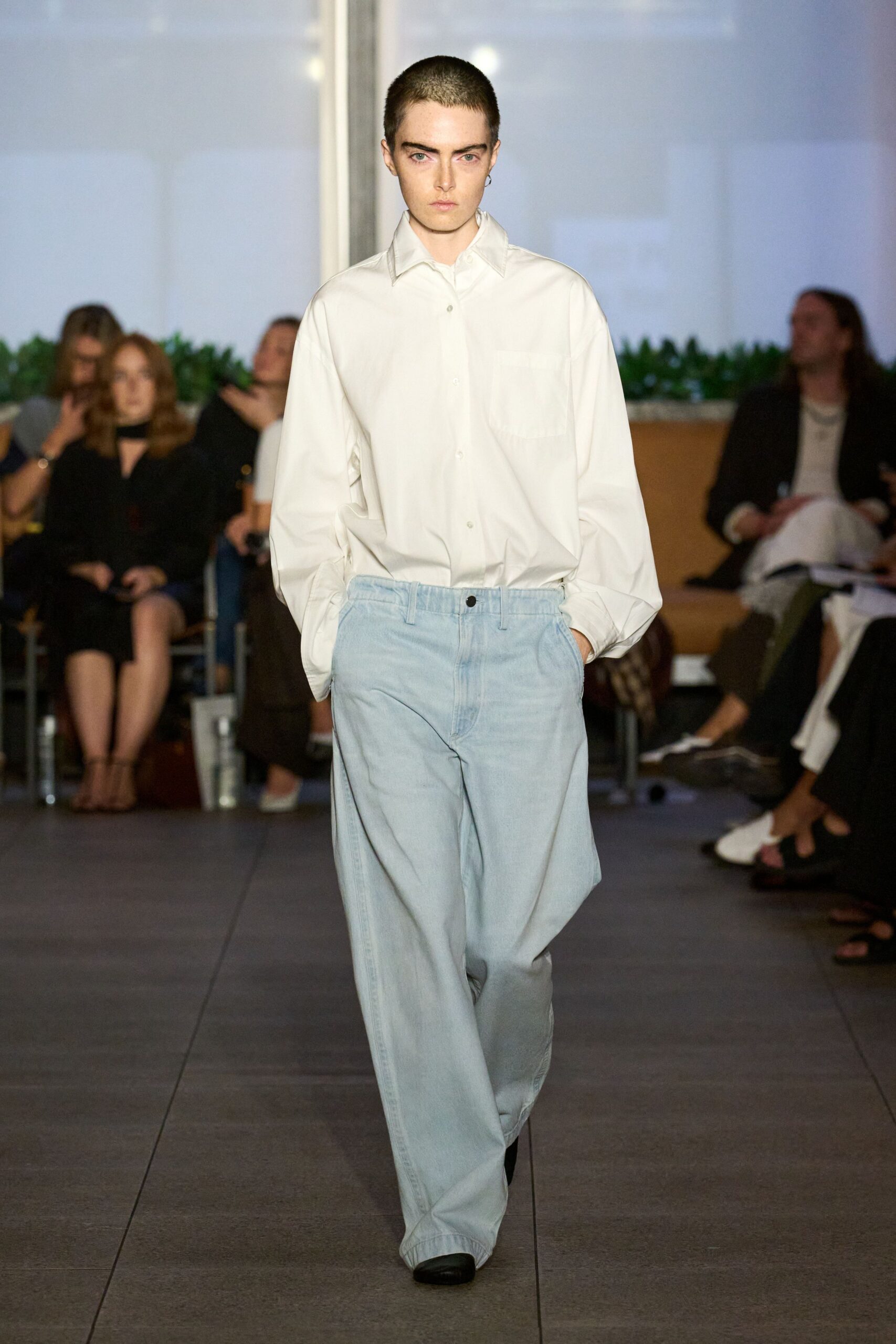 oversized white shirt with relaxed blue pants