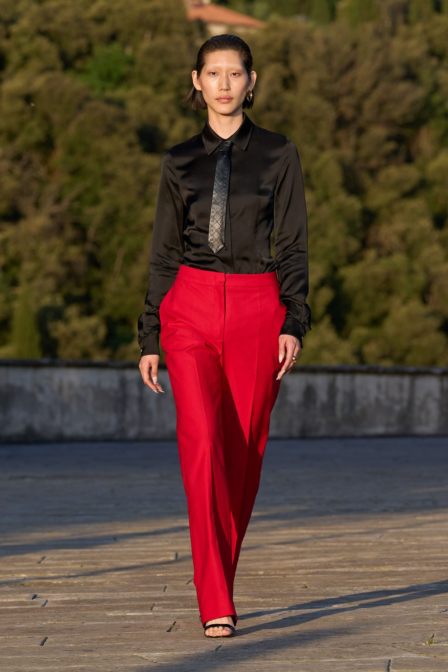 black silk shirt red tailored pants