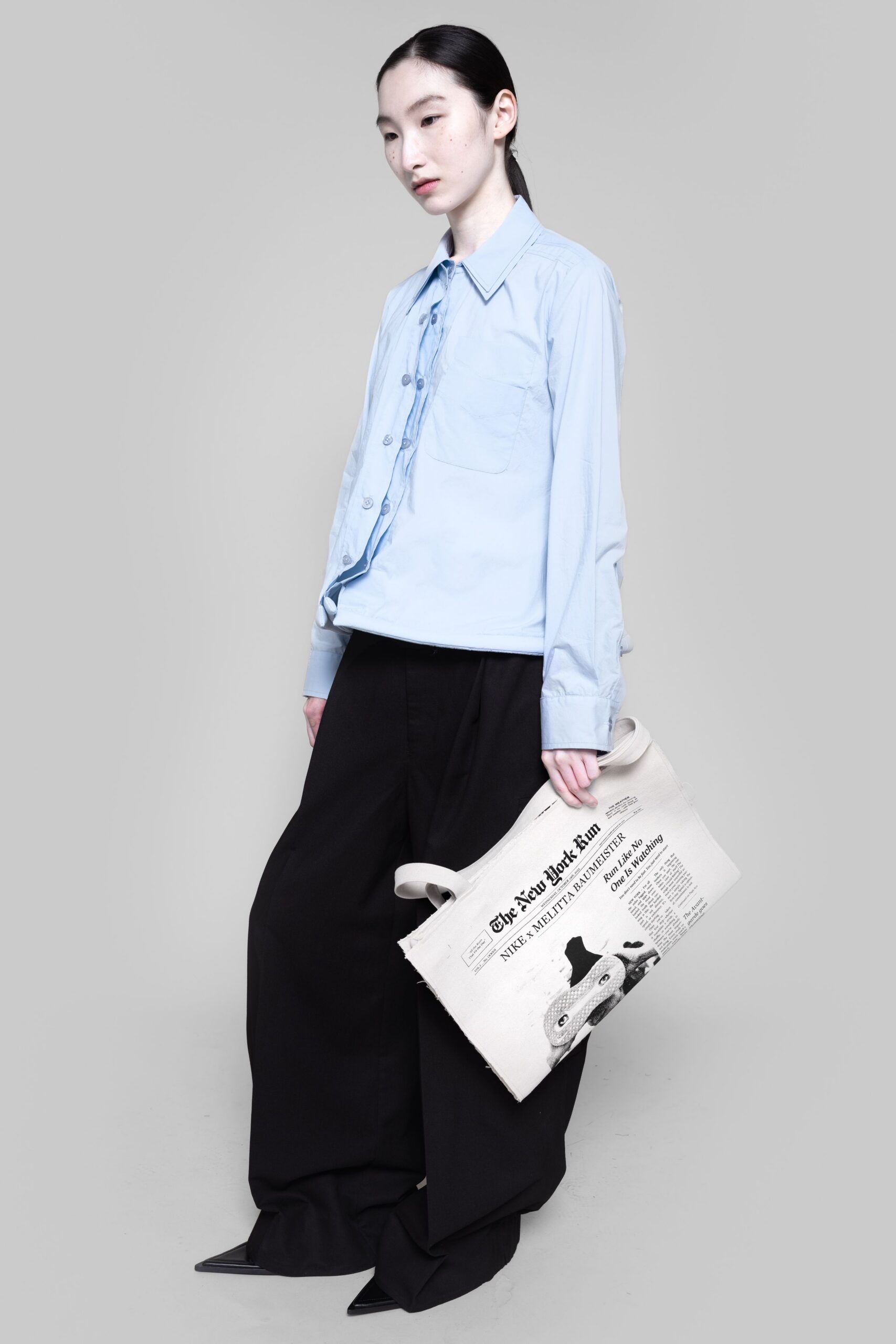 blue cotton shirt with black pants