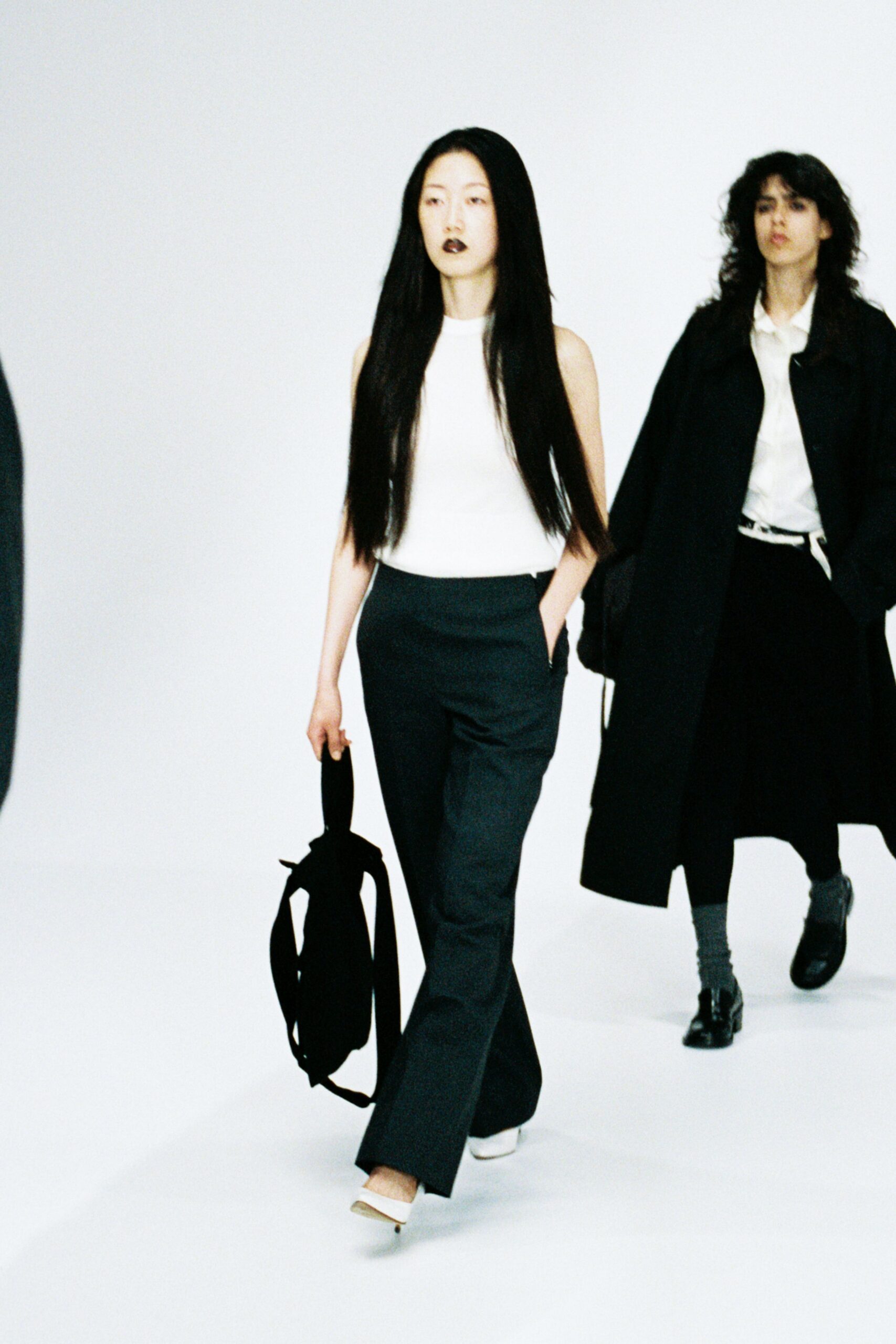 white sleeveless top with black pants