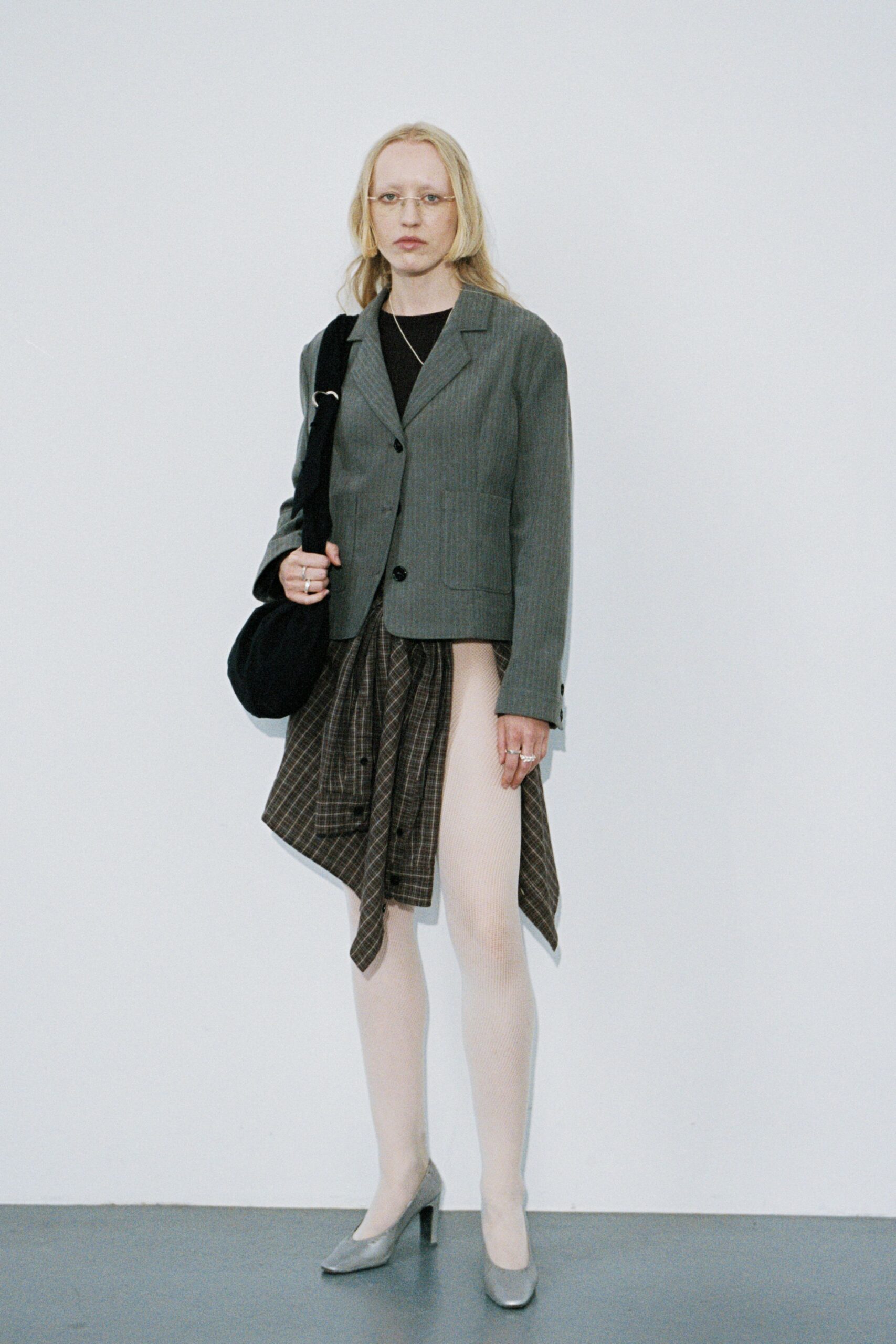 gray tailored blazer with checked skirt