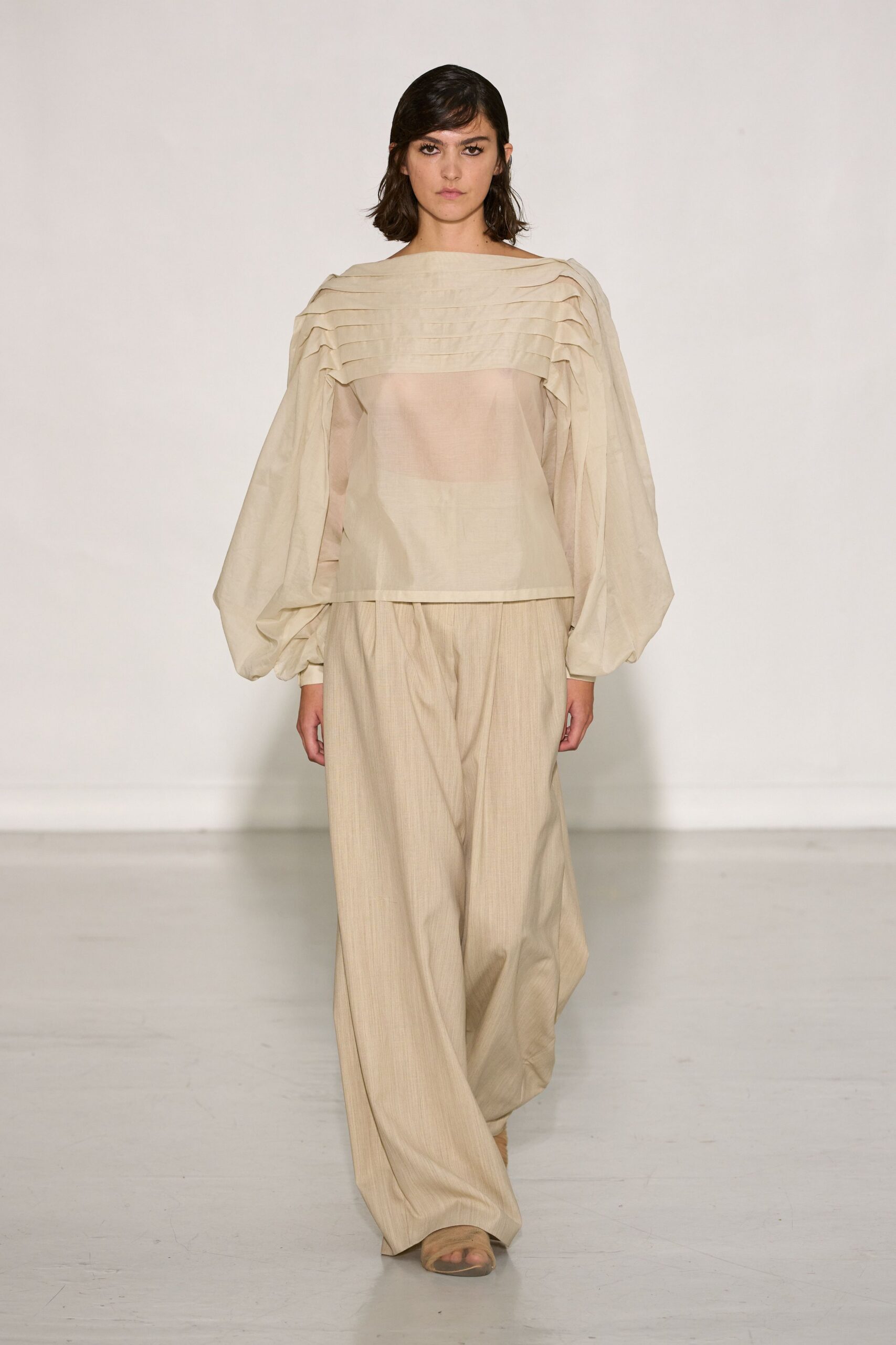 beige pleated top with relaxed pants