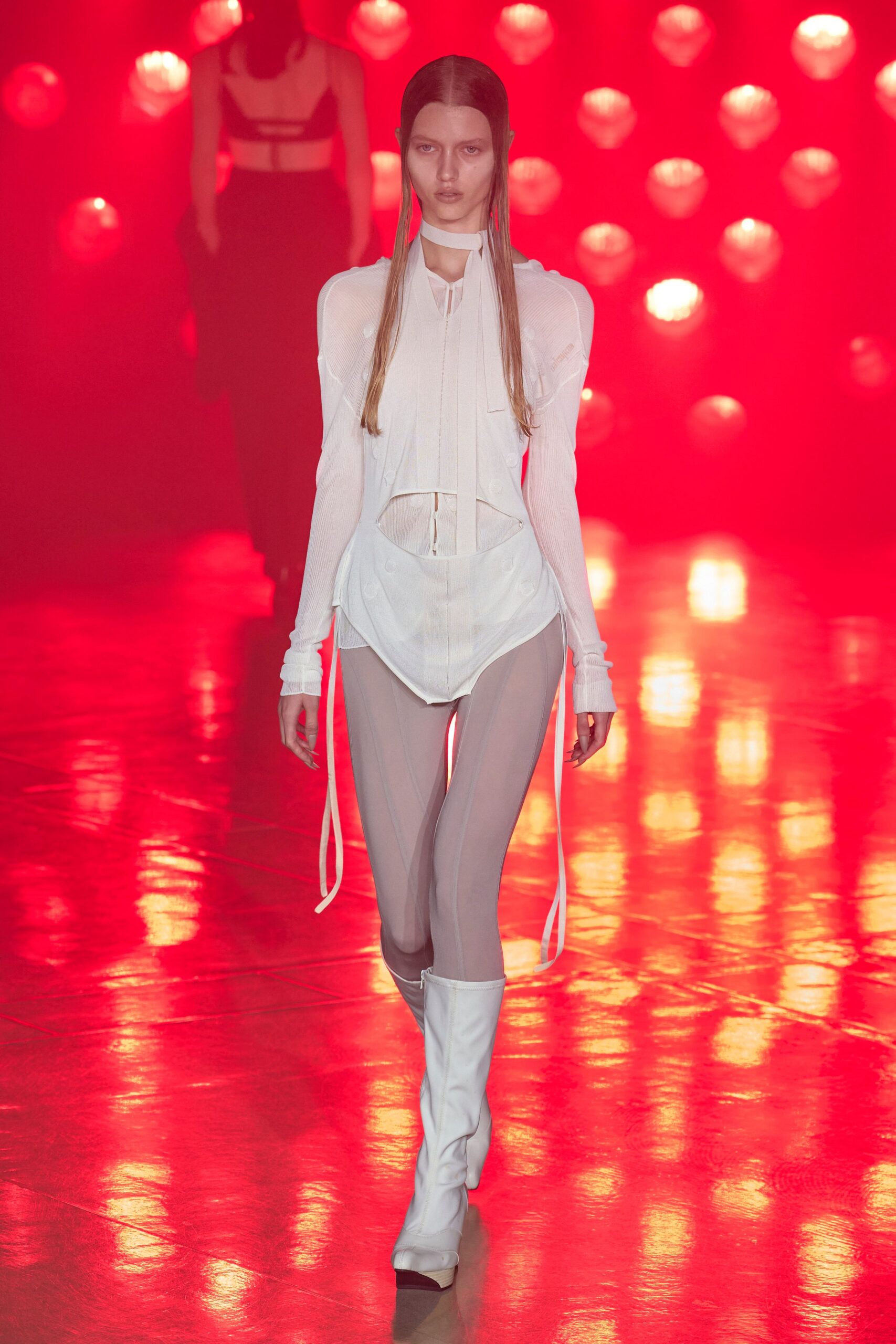 white fitted top beige pants white boots