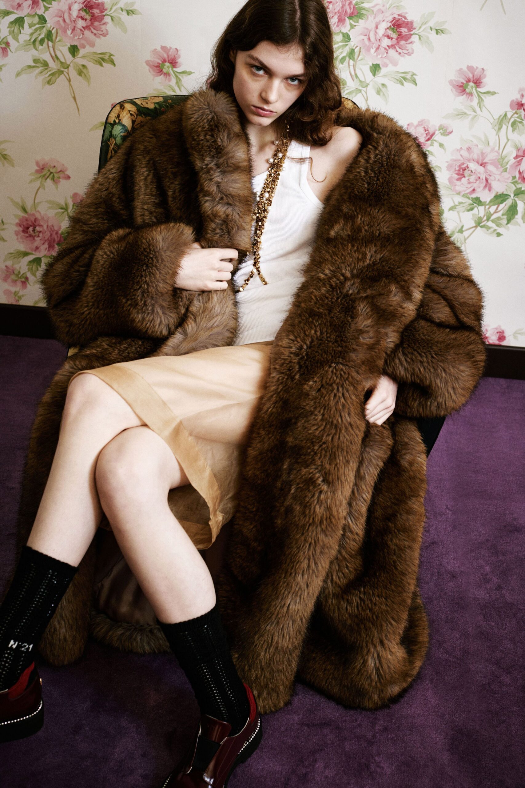 brown faux-fur coat with beige pleated skirt