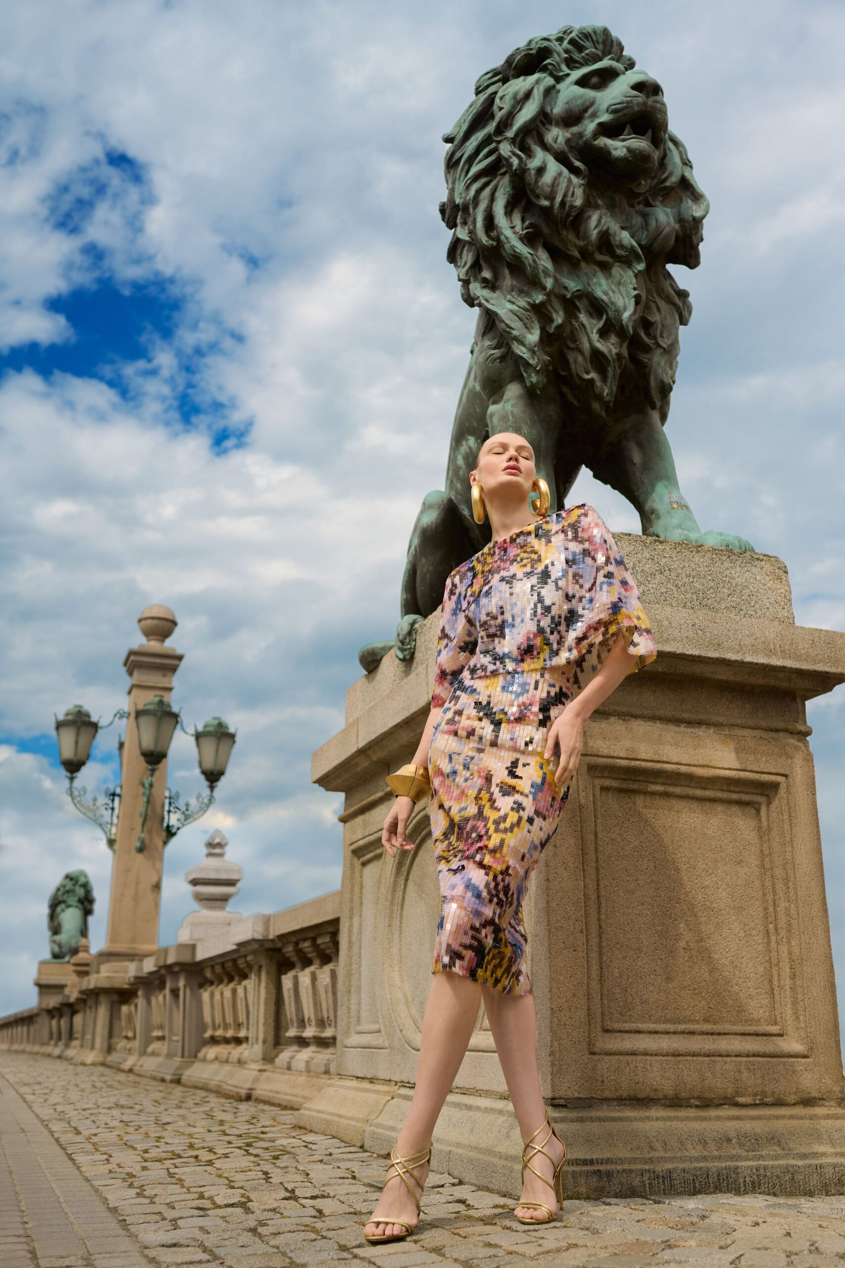 multi-colored fitted midi dress with strappy shoes