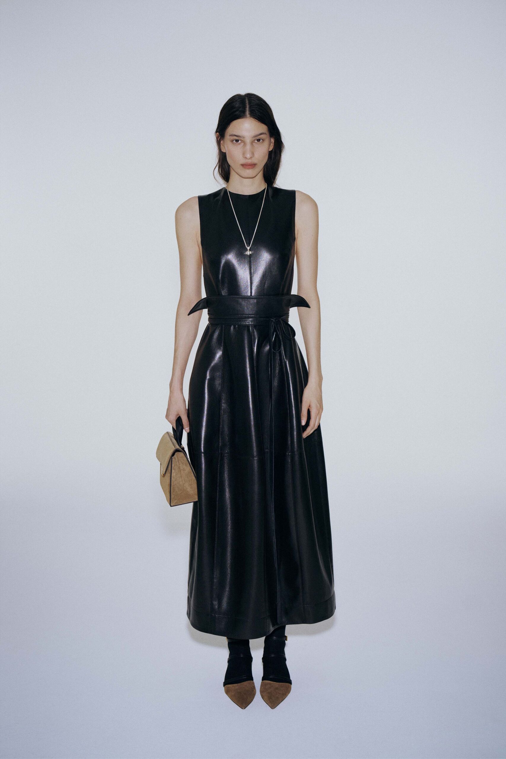 black leather sleeveless high-neck fitted belted a-line dress