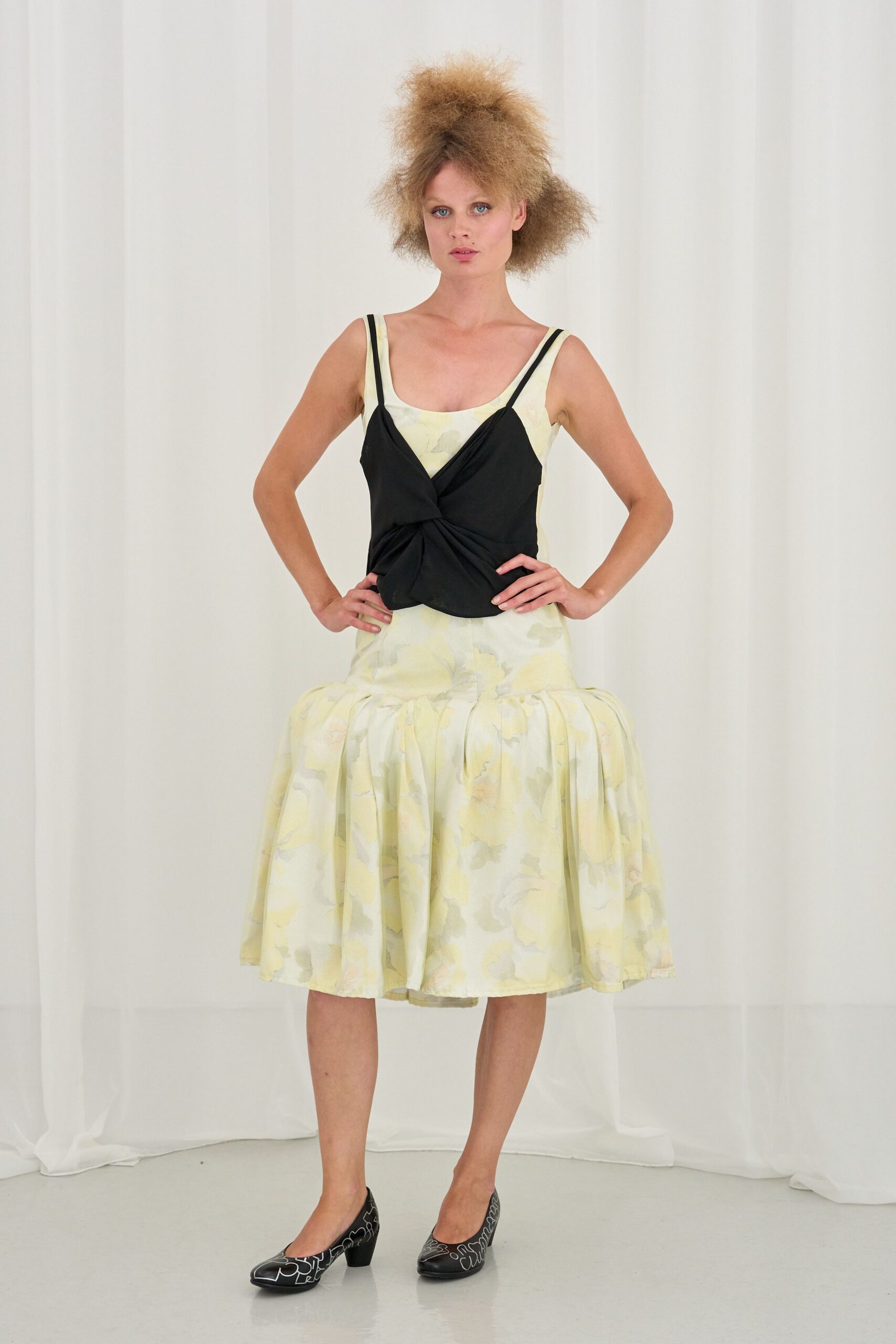 yellow pleated midi dress with black top