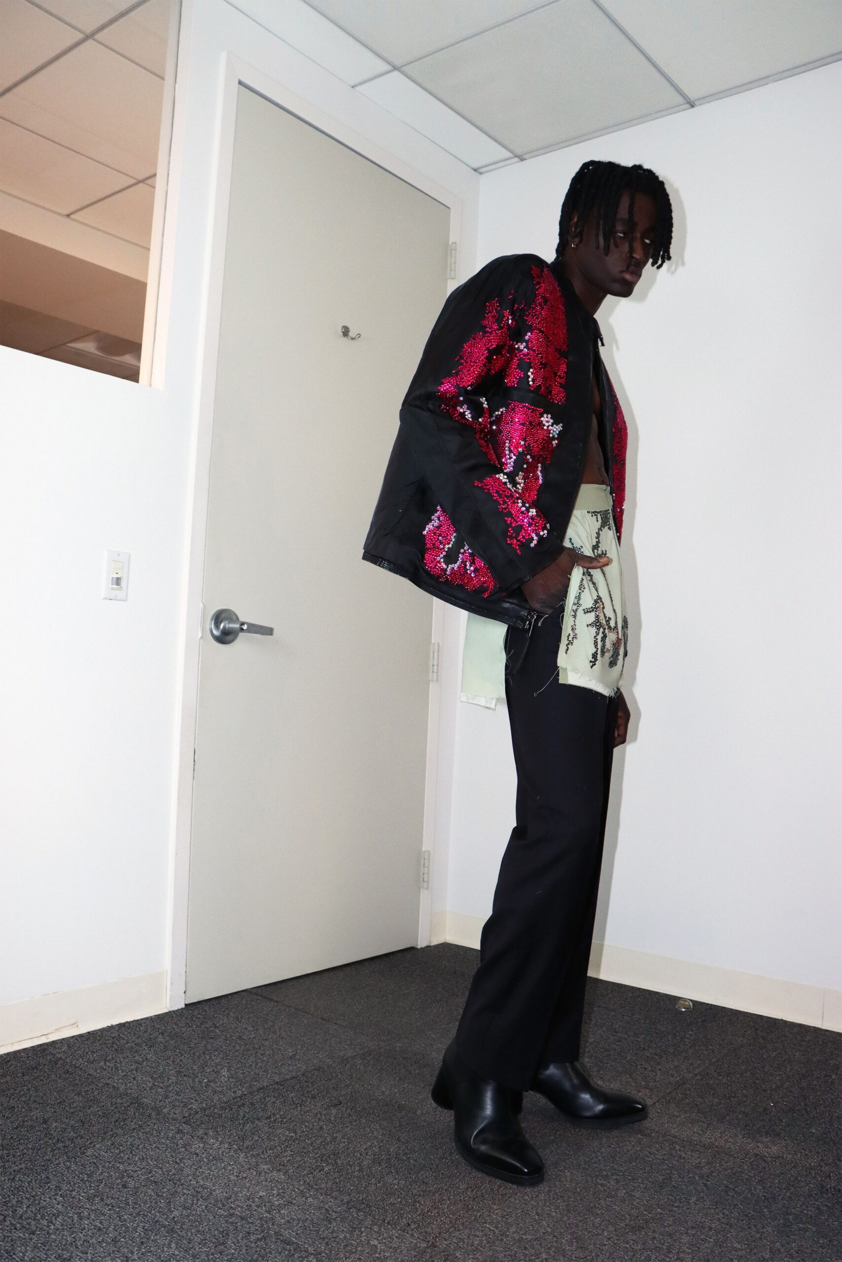 black red sequined jacket with green shirt