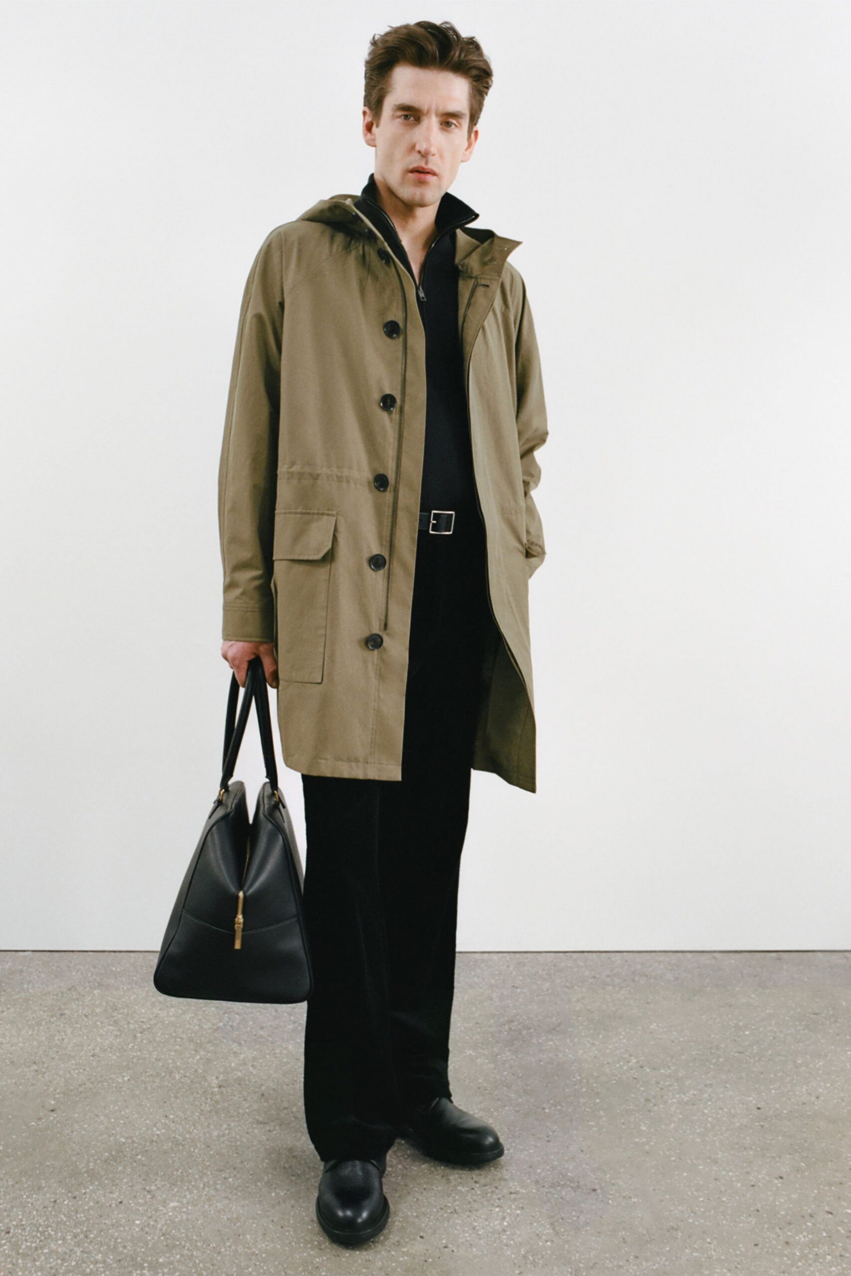 beige coat black shirt pants
