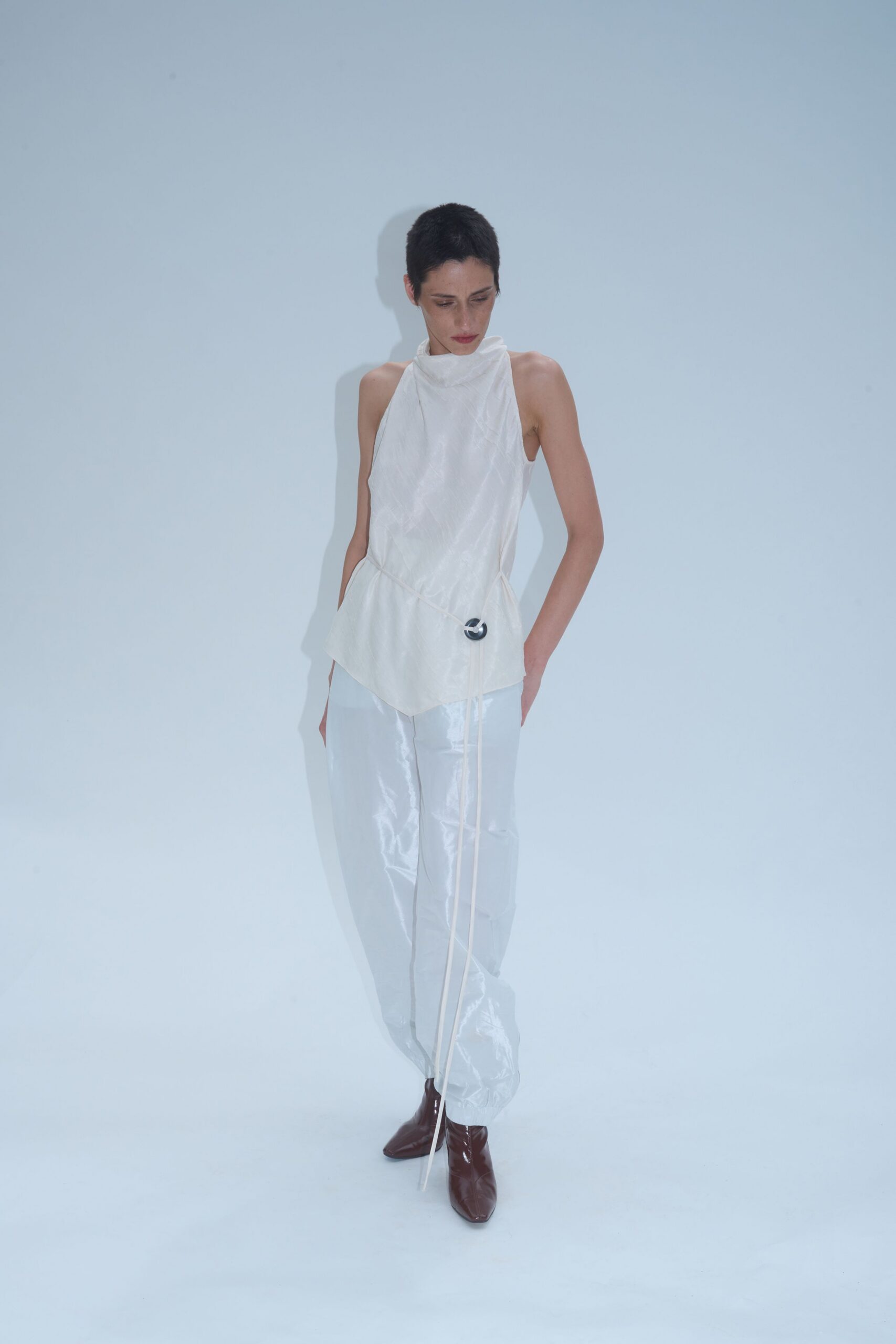 white vinyl relaxed zippered shiny pants
