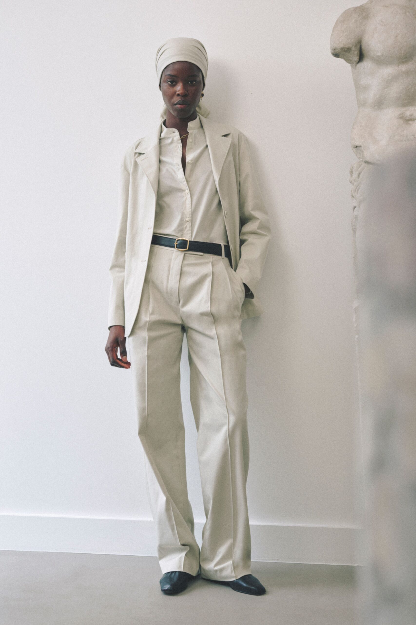 beige tailored suit with white shirt