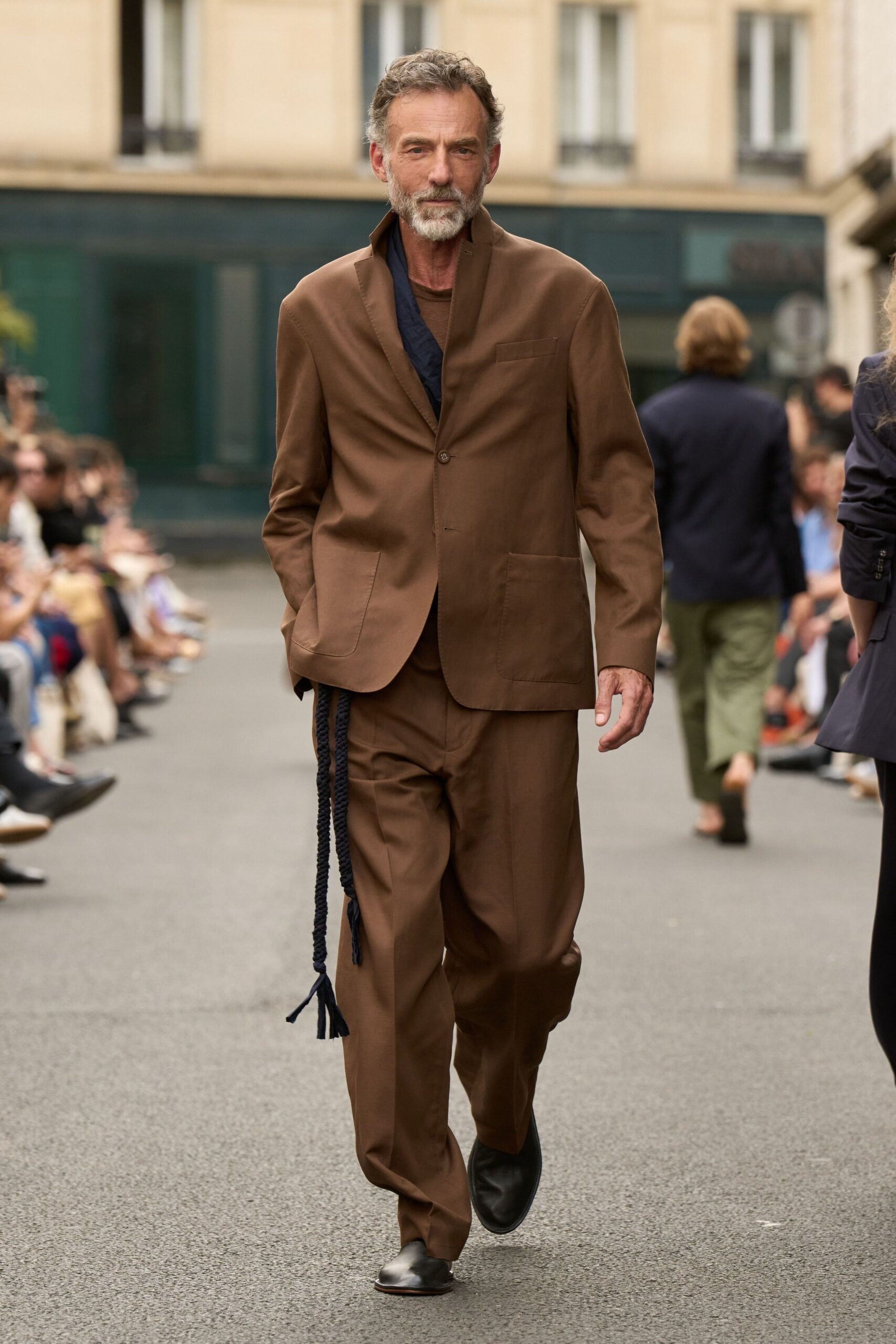 brown tailored suit with black shoes
